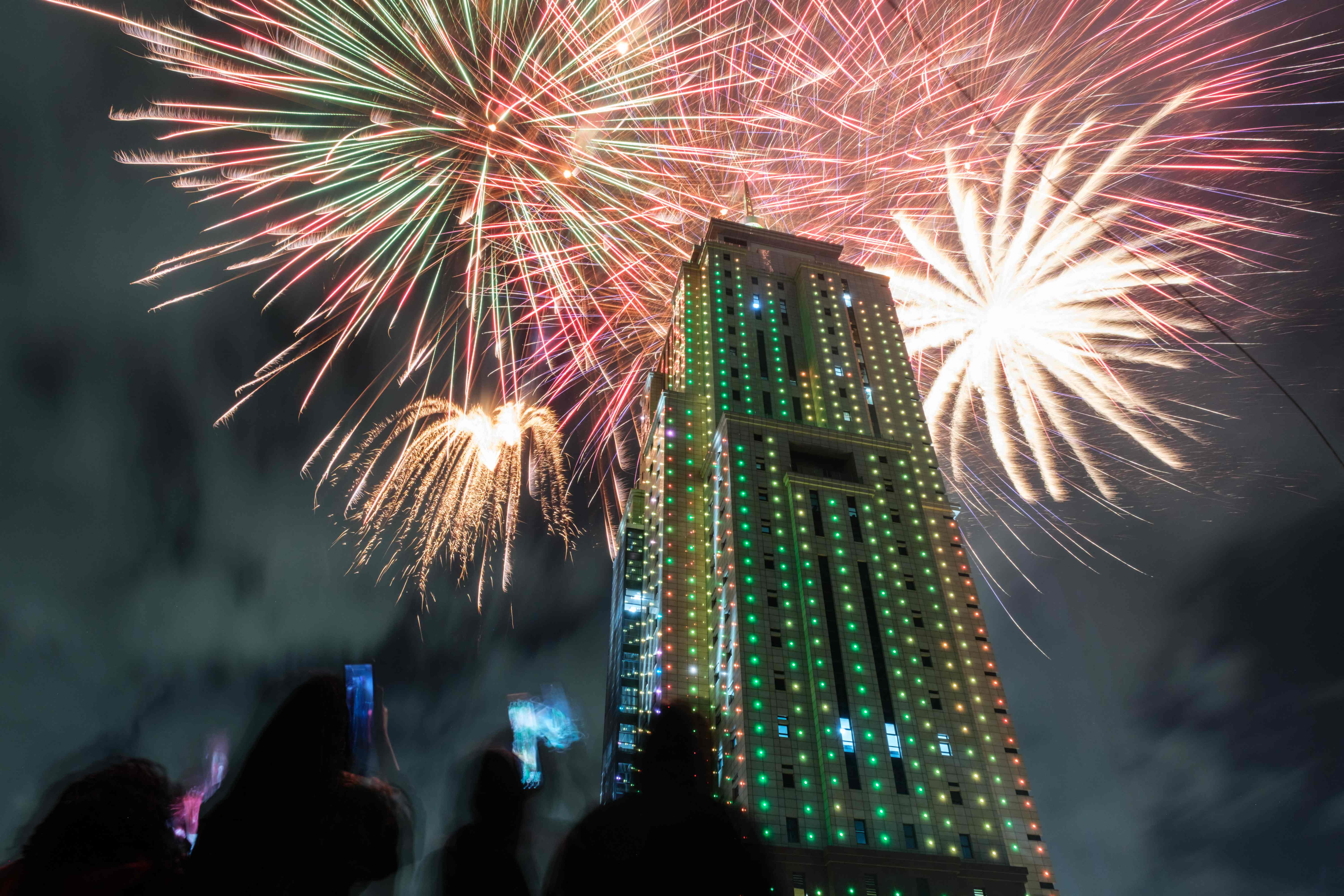 People look at fireworks launching from the building of Old Mutual Tower to celebrate the new year in Nairobi