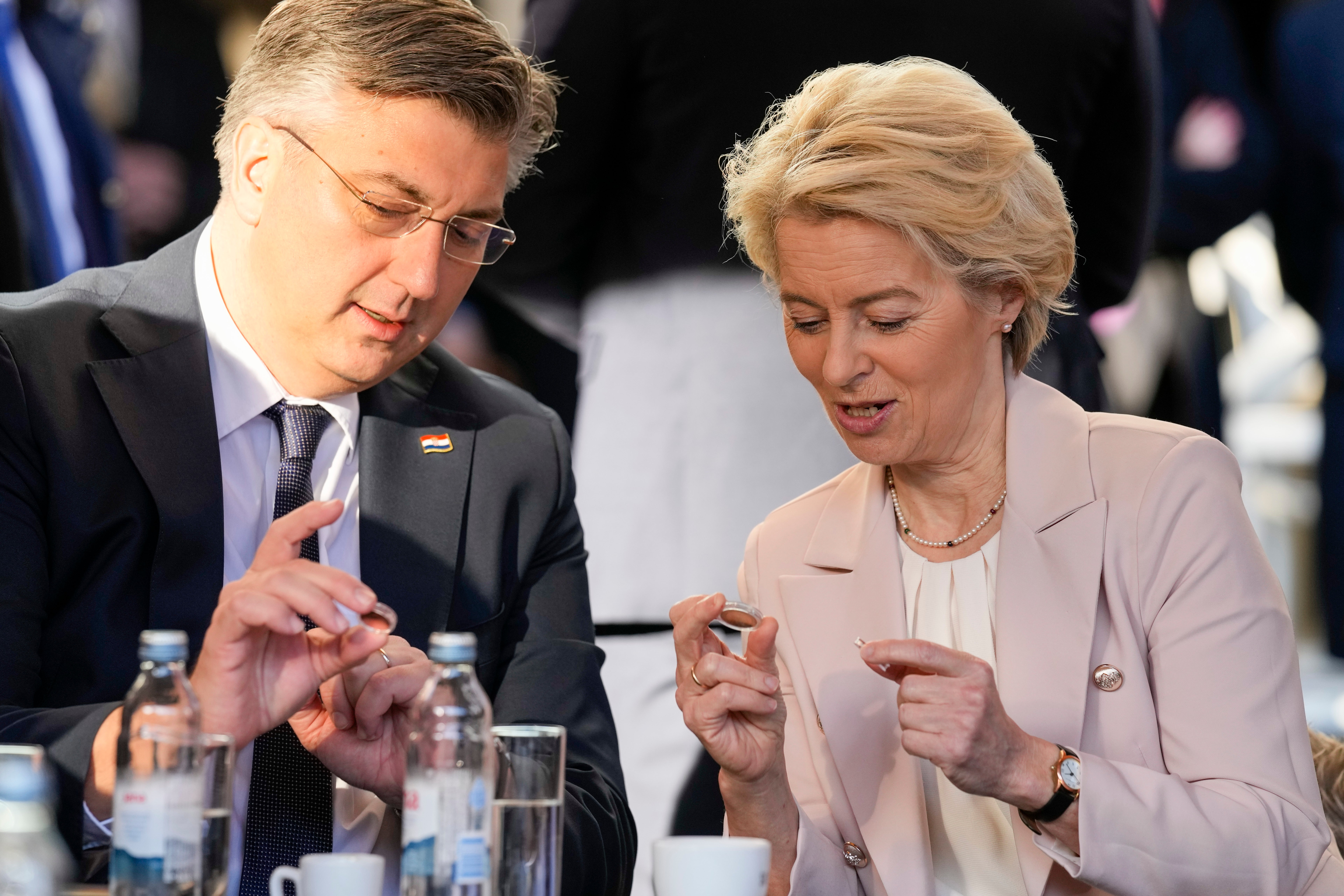 Croatia's Prime Minister Andrej Plenkovic and Ursula von der Leyen, President of the European Commission, inspect Croatian euro coins on New Year’s Day