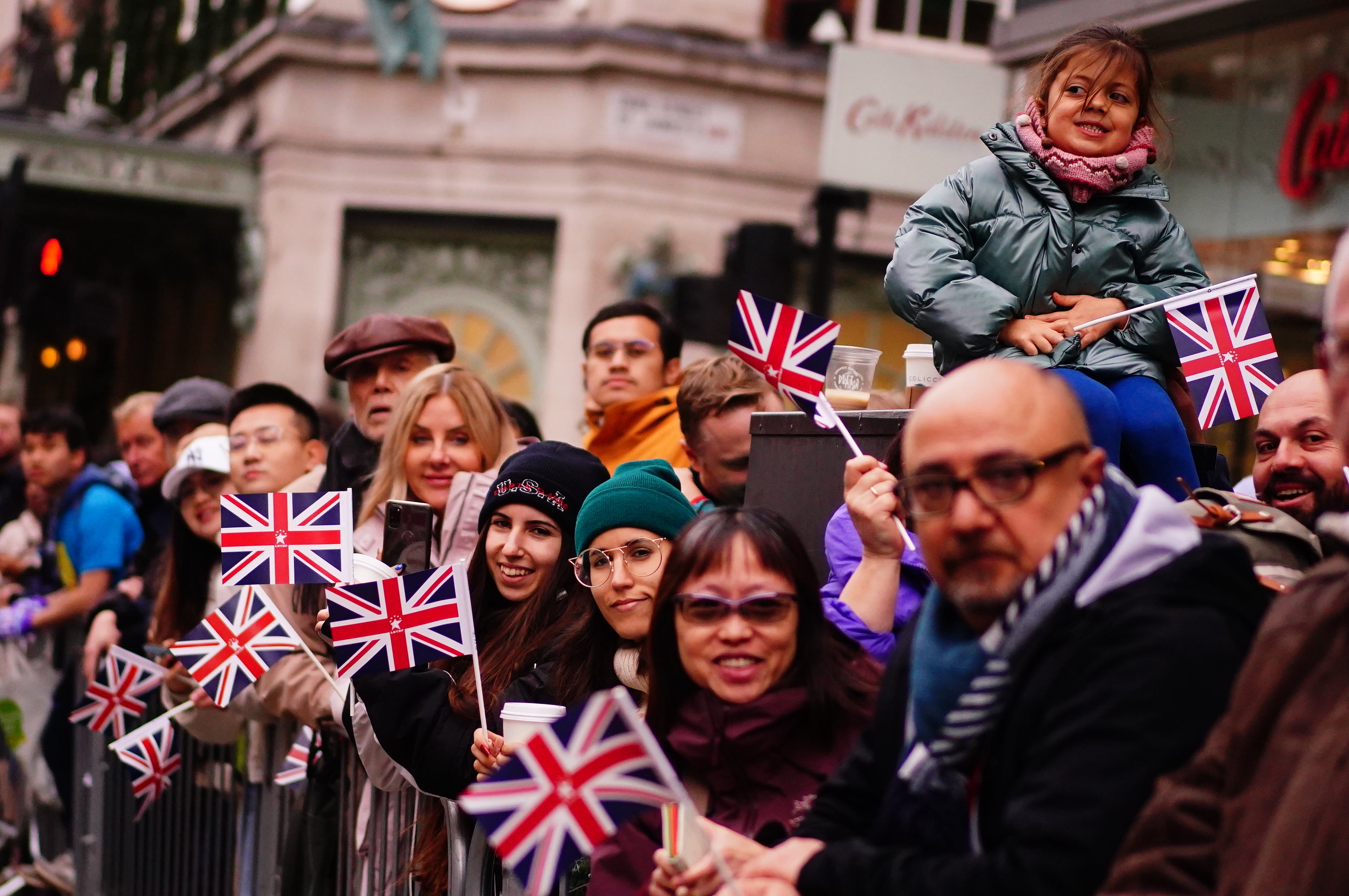 Crowds watch performers during the city’s parade