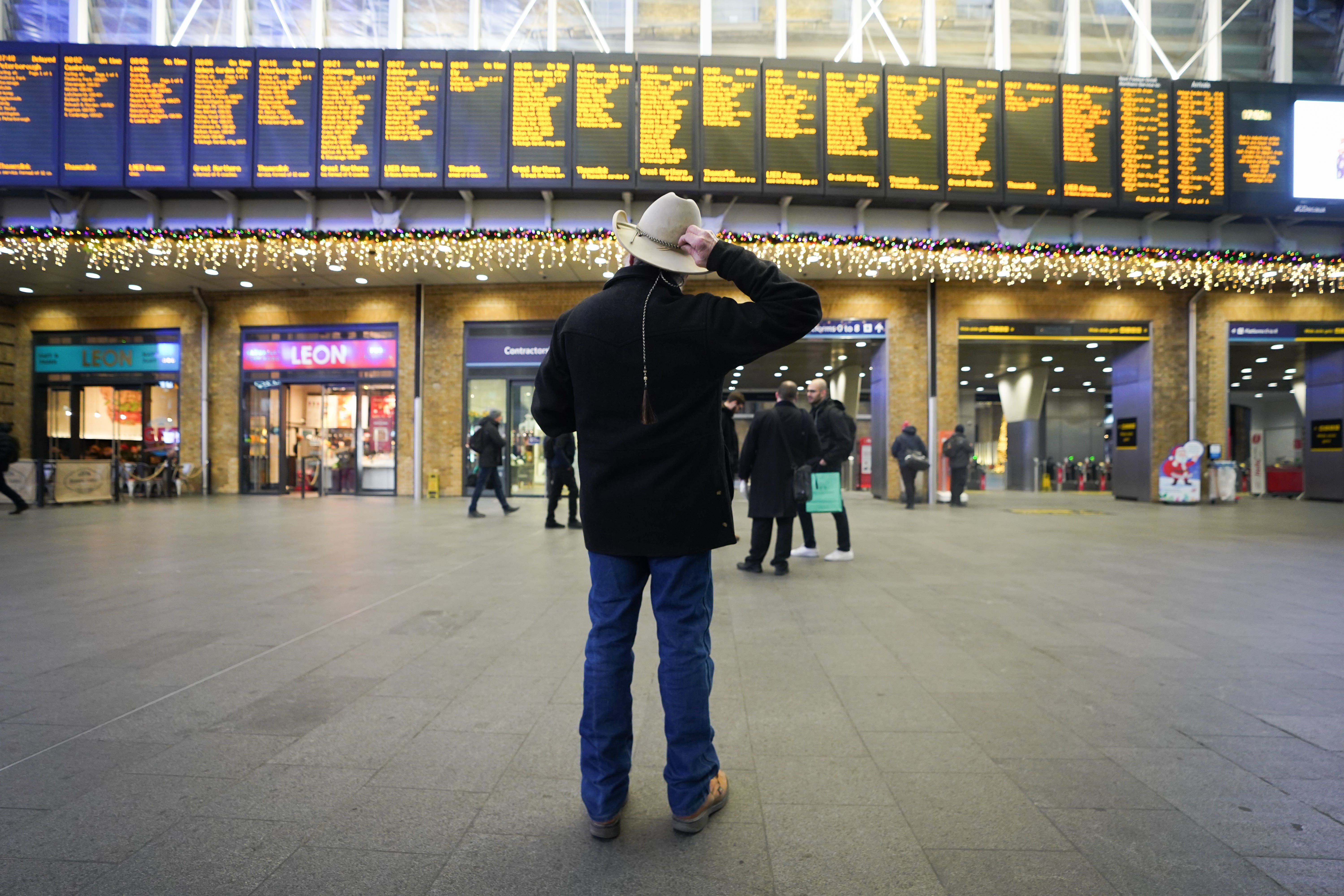 Passengers at King’s Cross Station in London during strike action (James Manning/PA)