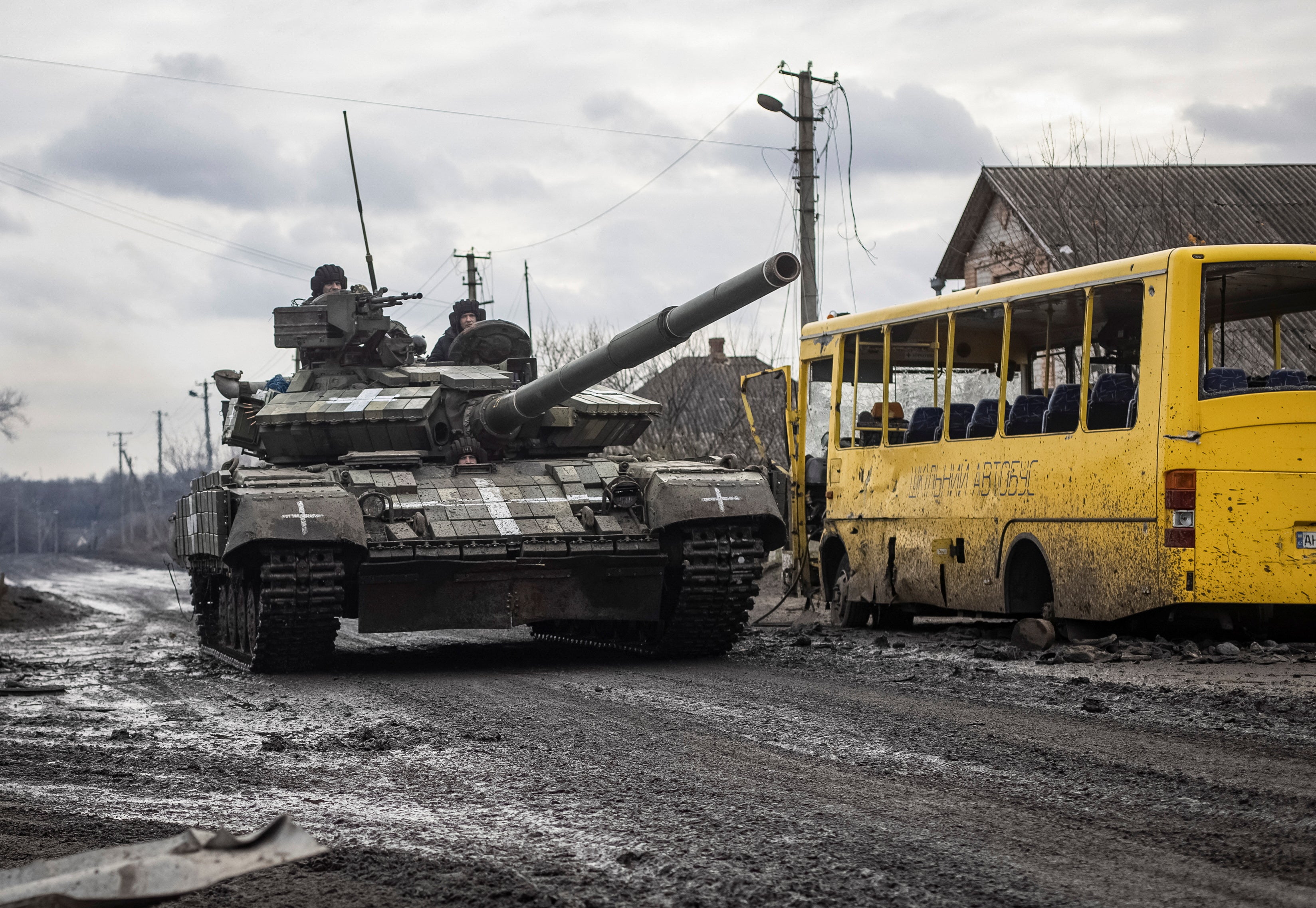 Ukrainian servicemen ride a tank in the village of Torske, Donetsk