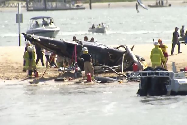 The wreckage of both helicopters is on a sand bank on the Gold Coast, making recovery efforts difficult