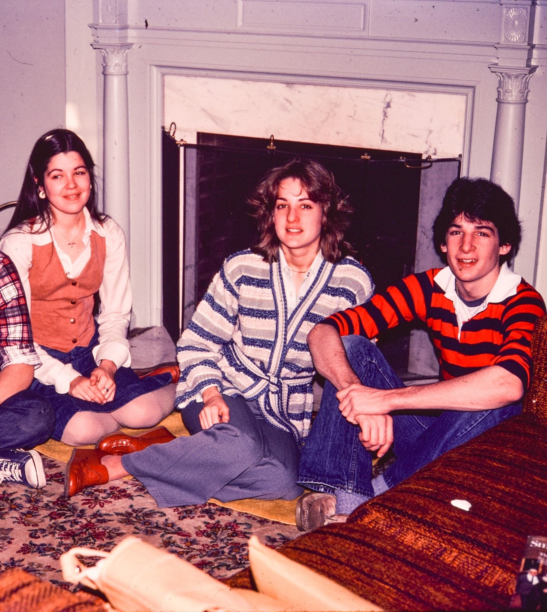 A young Montes, centre, poses with her sister, Lucy, left, who became a translator for the FBI, and brother Tito, right, who became an agent