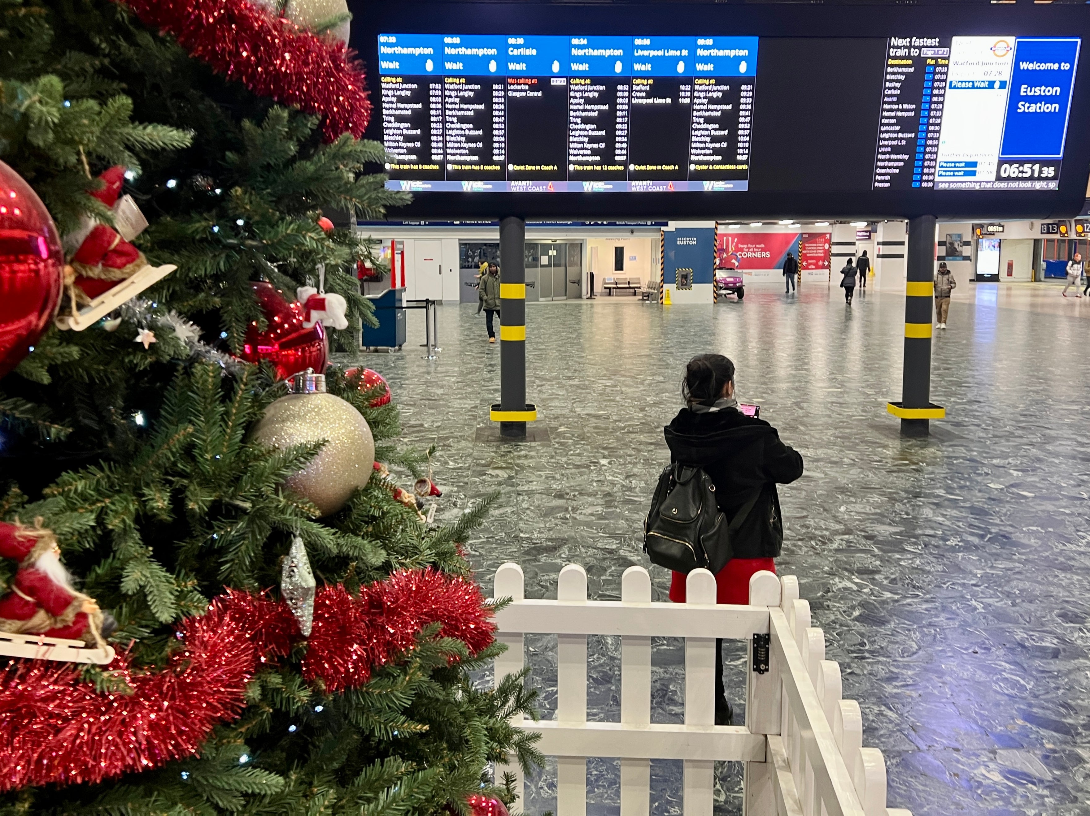 Back to work? Commuter at London Euston station