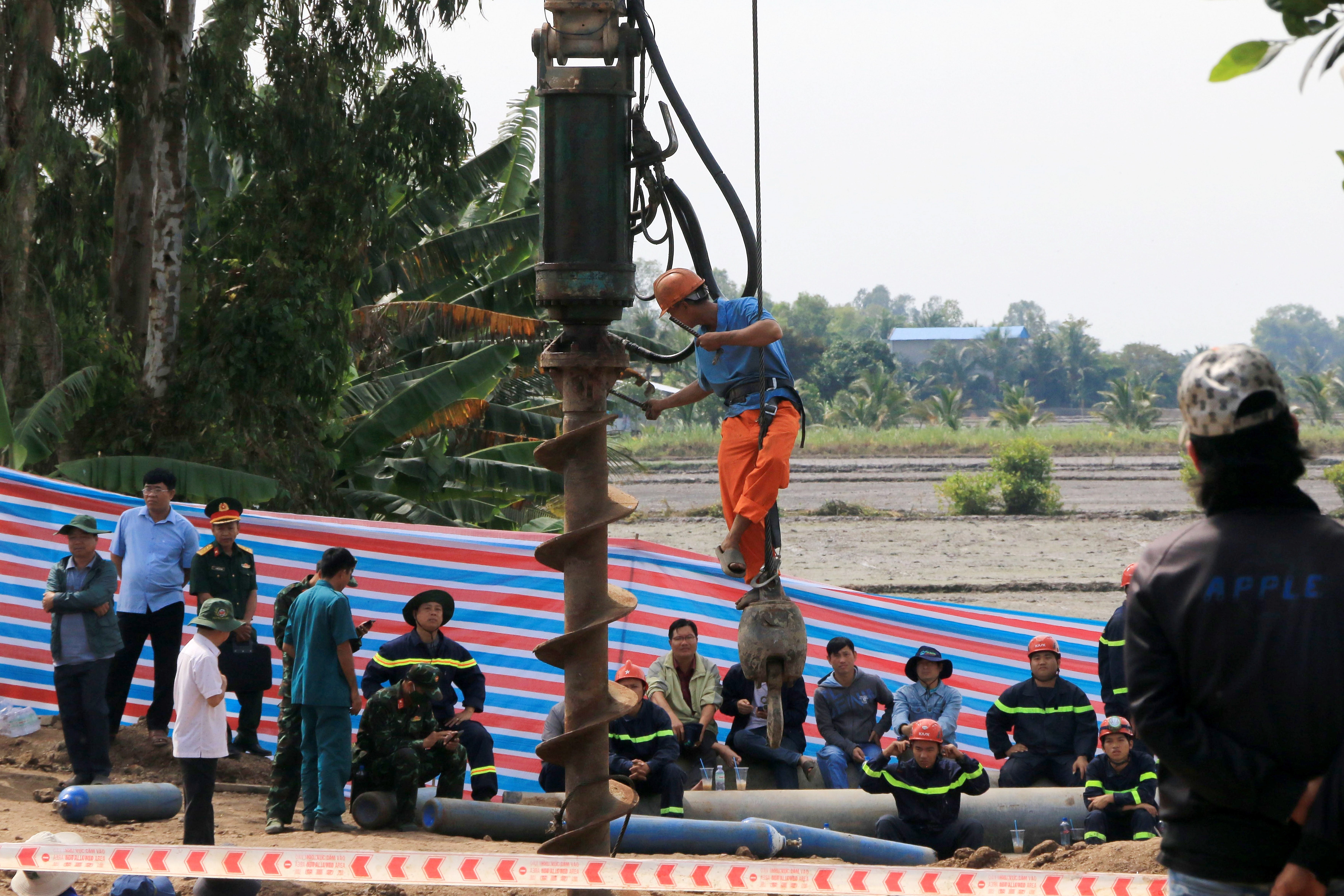 Rescuers race to free Vietnamese boy trapped in shaft