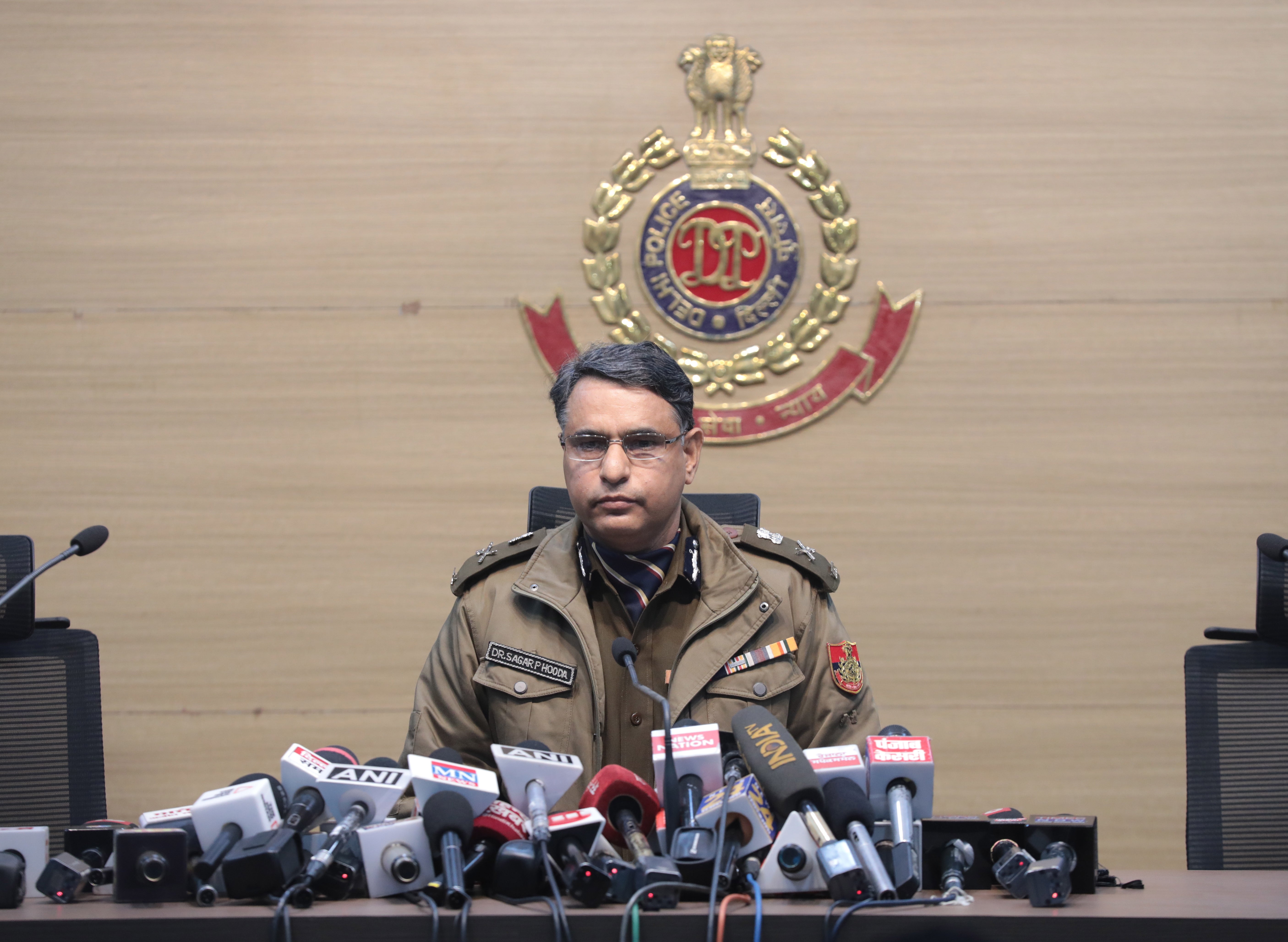 Special commissioner of police Sagar Preet Hooda addresses a press conference