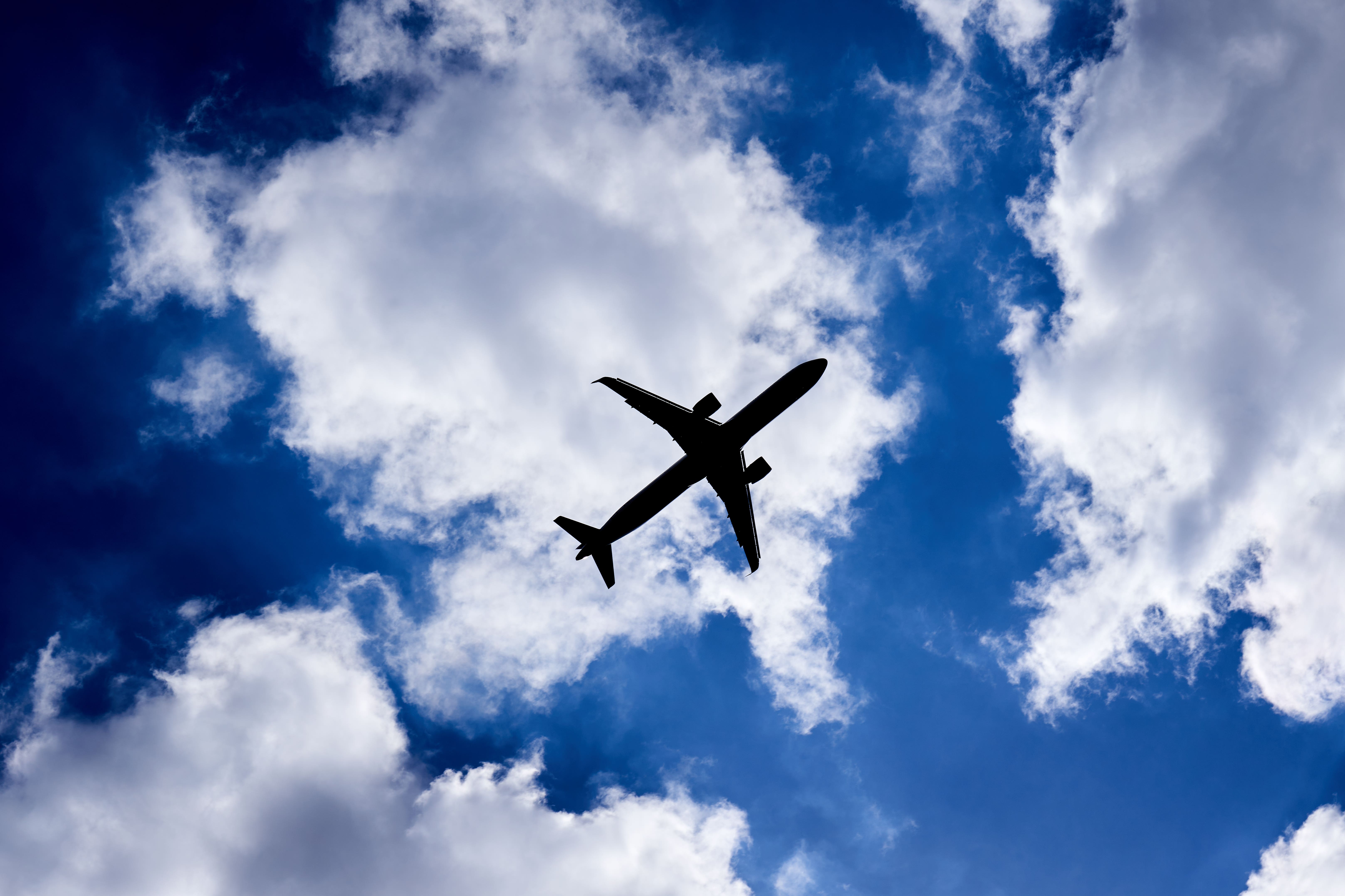 A silhouette of a plane as it passes overhead in Isleworth, West London (John Walton/PA)