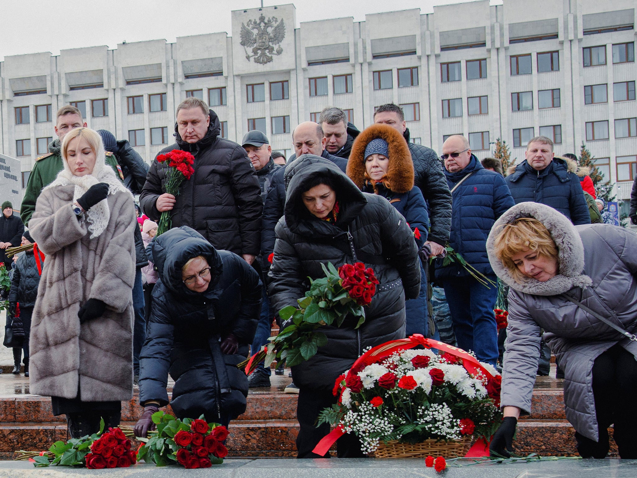 Participants lay flowers in Glory Square in Samara, where some of the 63 troops declared dead were said to be from