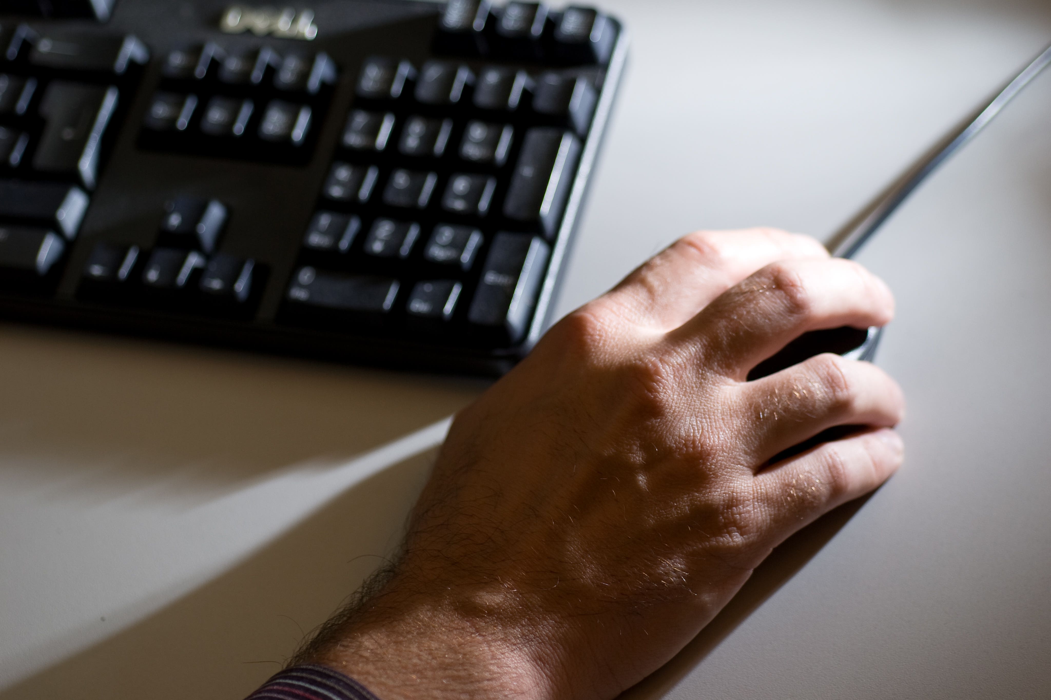 Someone working with a computer mouse (Adam Peck/PA)