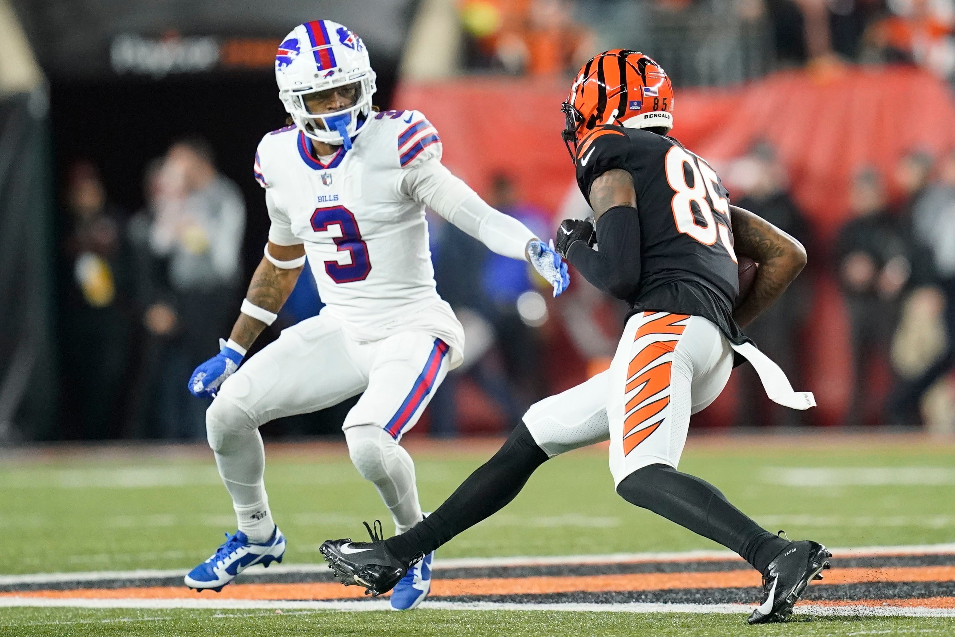 Cincinnati Bengals wide receiver Tee Higgins (85) runs near Buffalo Bills safety Damar Hamlin during the first half