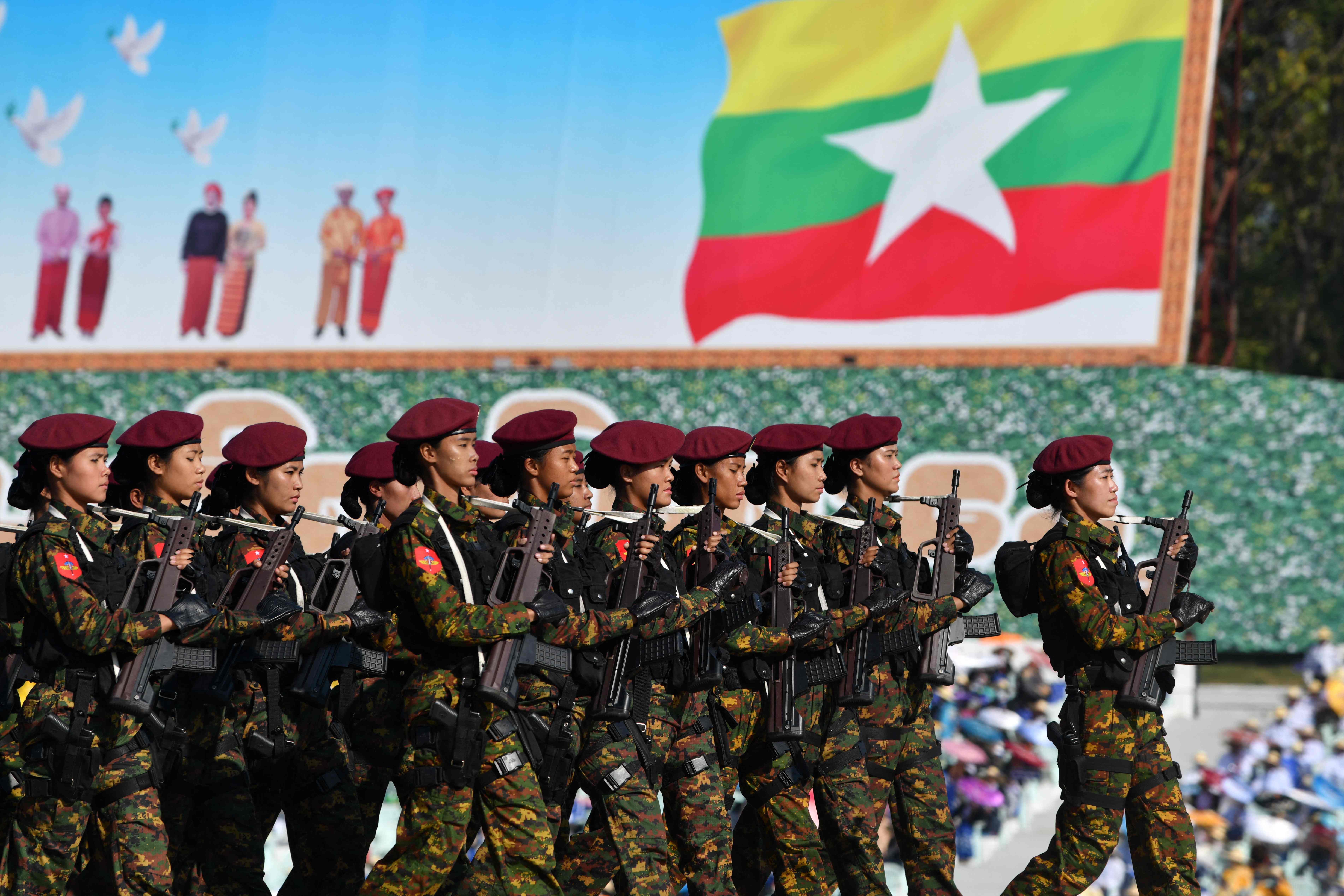 Members of the Myanmar military march at a parade ground