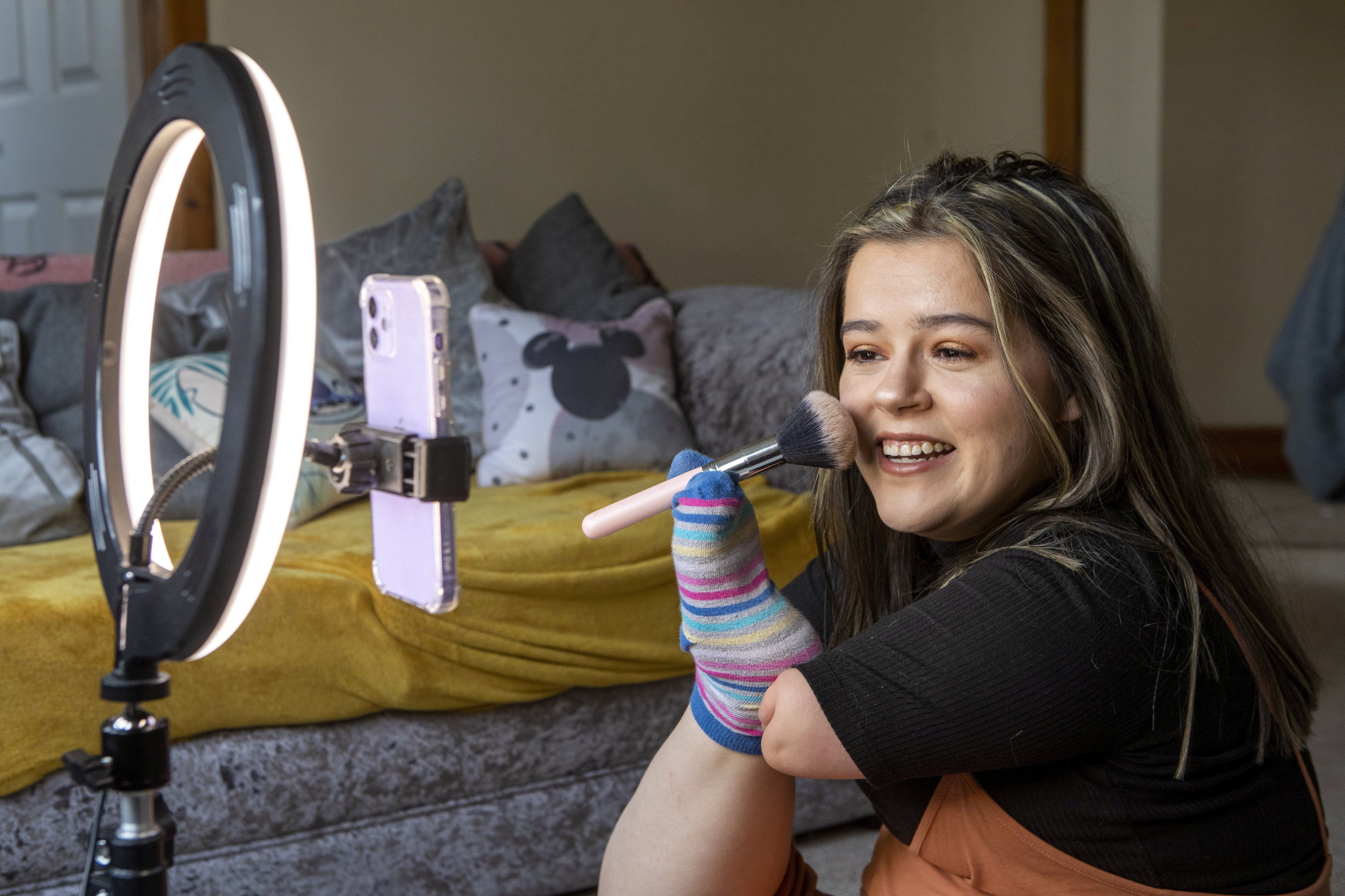 Brianne Surgeoner, from Paisley, was born with no arms and applies make-up with her feet