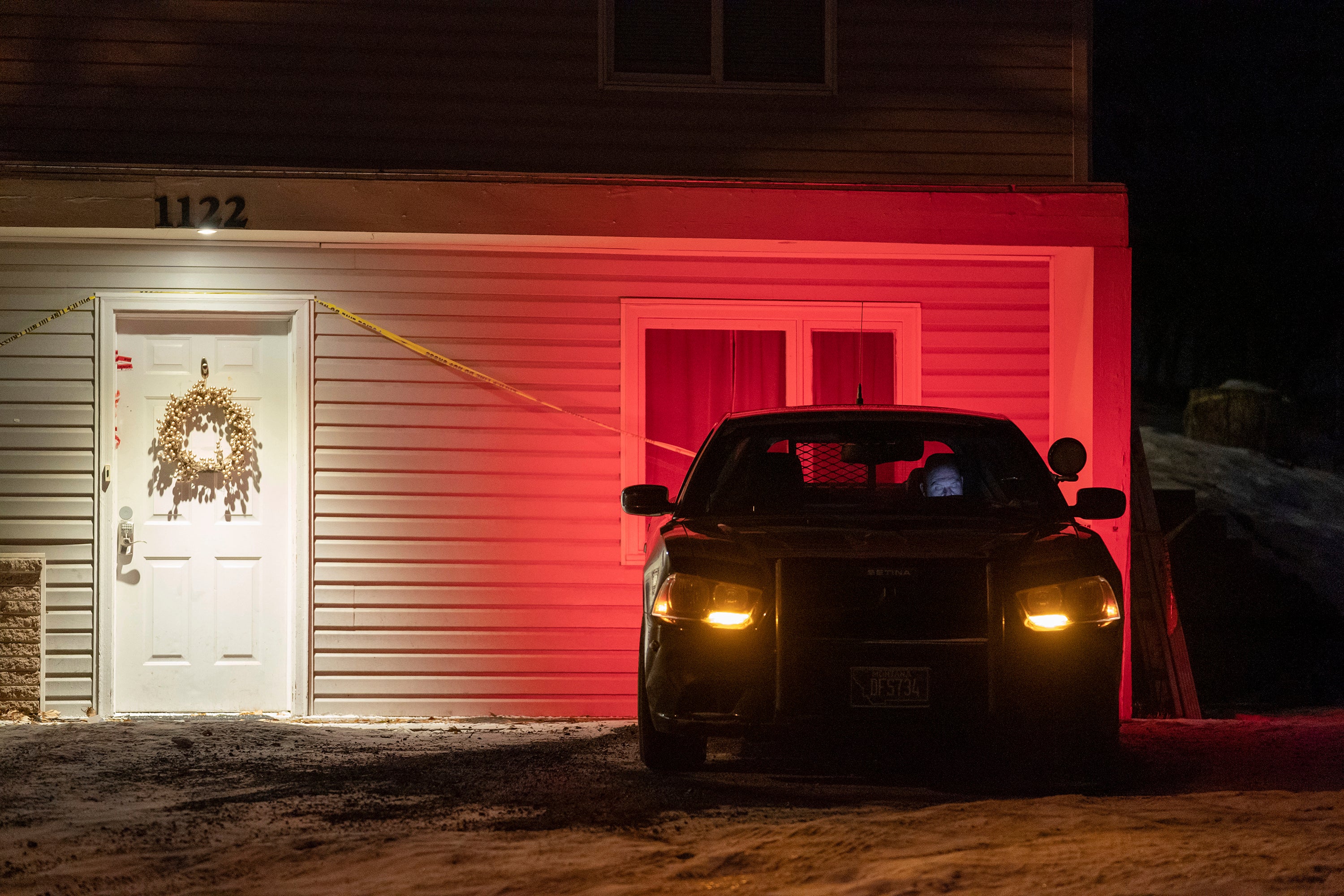 A private security guard outside the home where four University of Idaho students were killed on 13 November