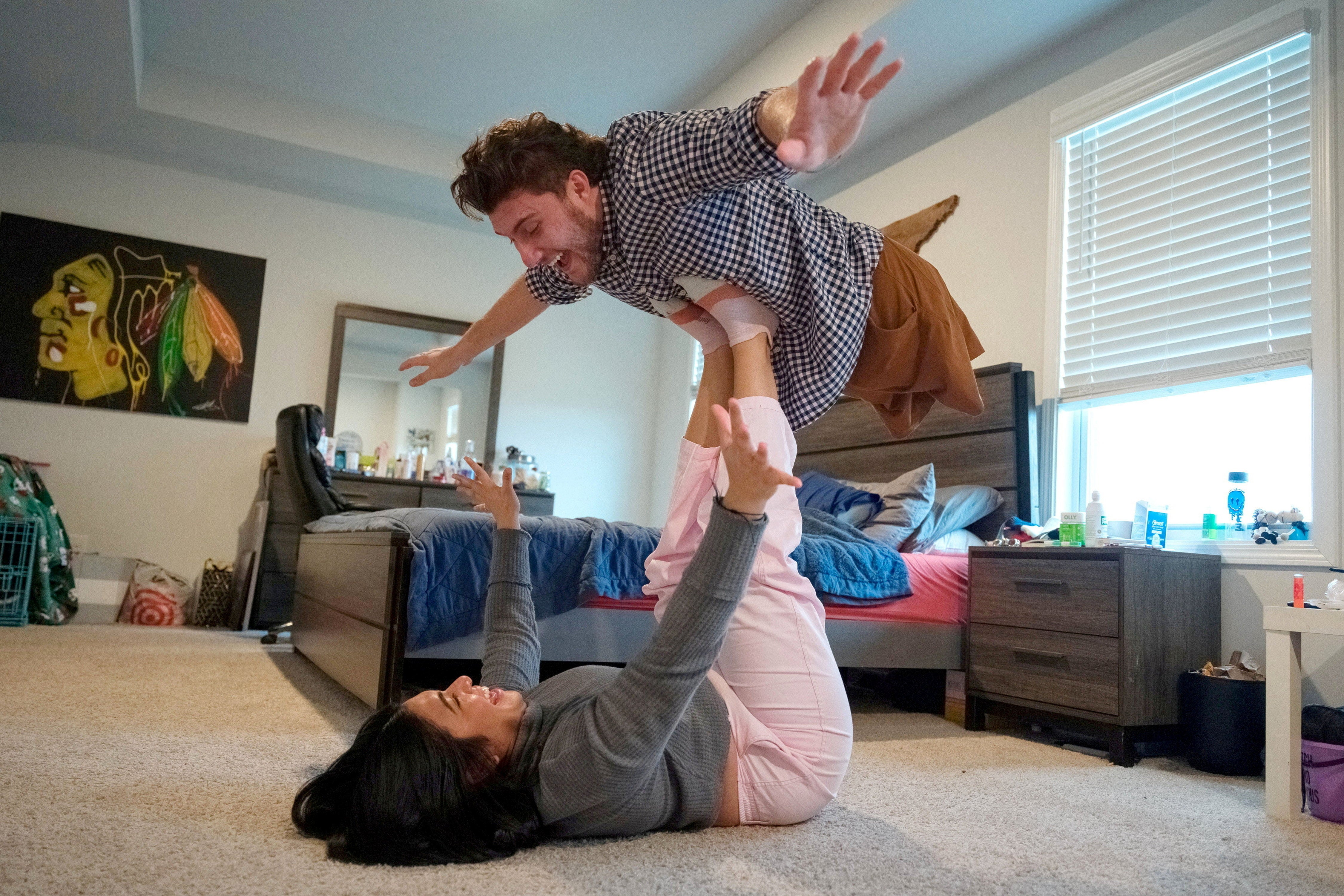 Brody Roybal, who is missing the bottom half of his body, with his girlfriend at home in Smyrna, Tennessee, before beginning his third Paralympics Games