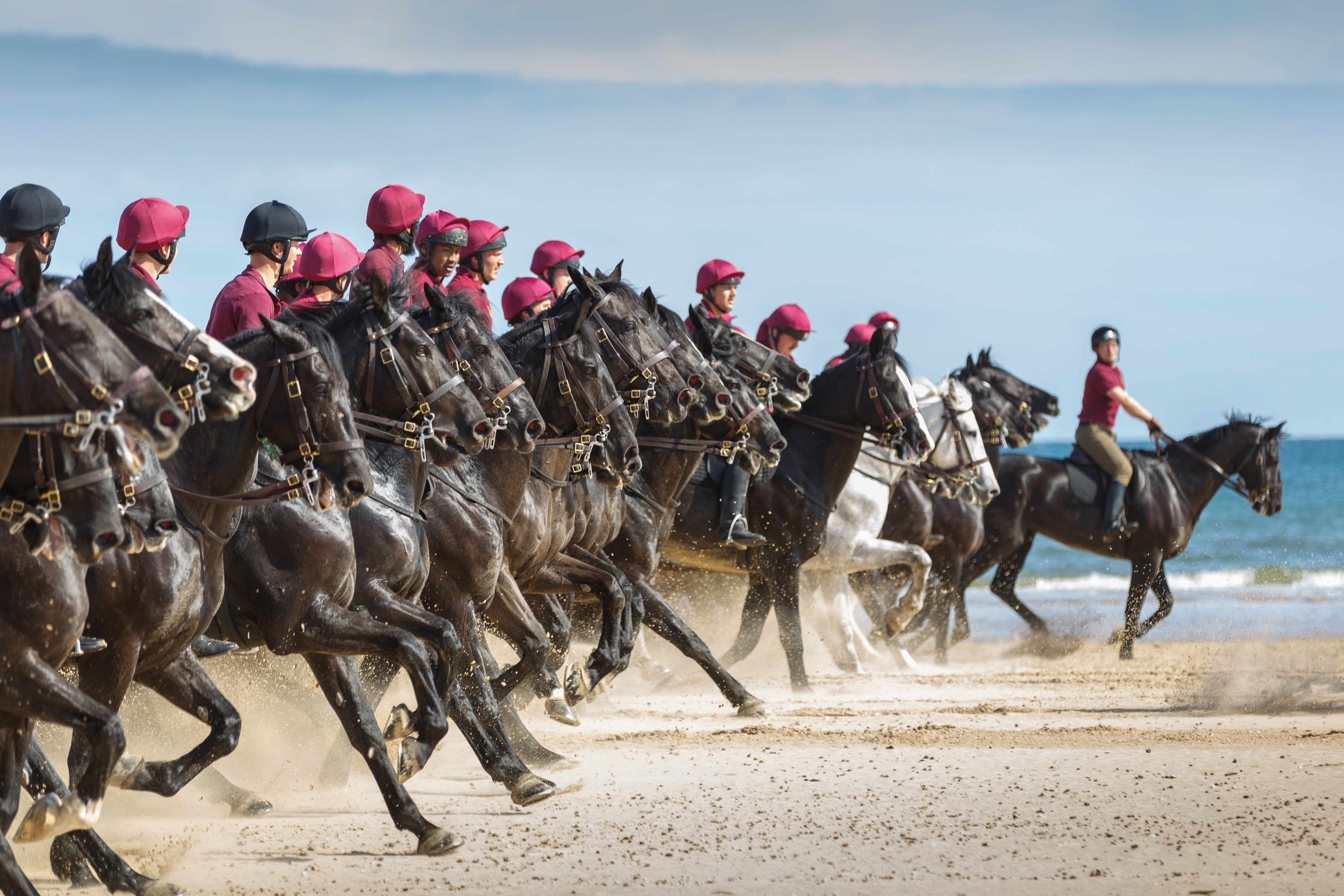 The Household Cavalry Mounted Regiment is seen enjoying its ‘summer camp’ in Norfolk