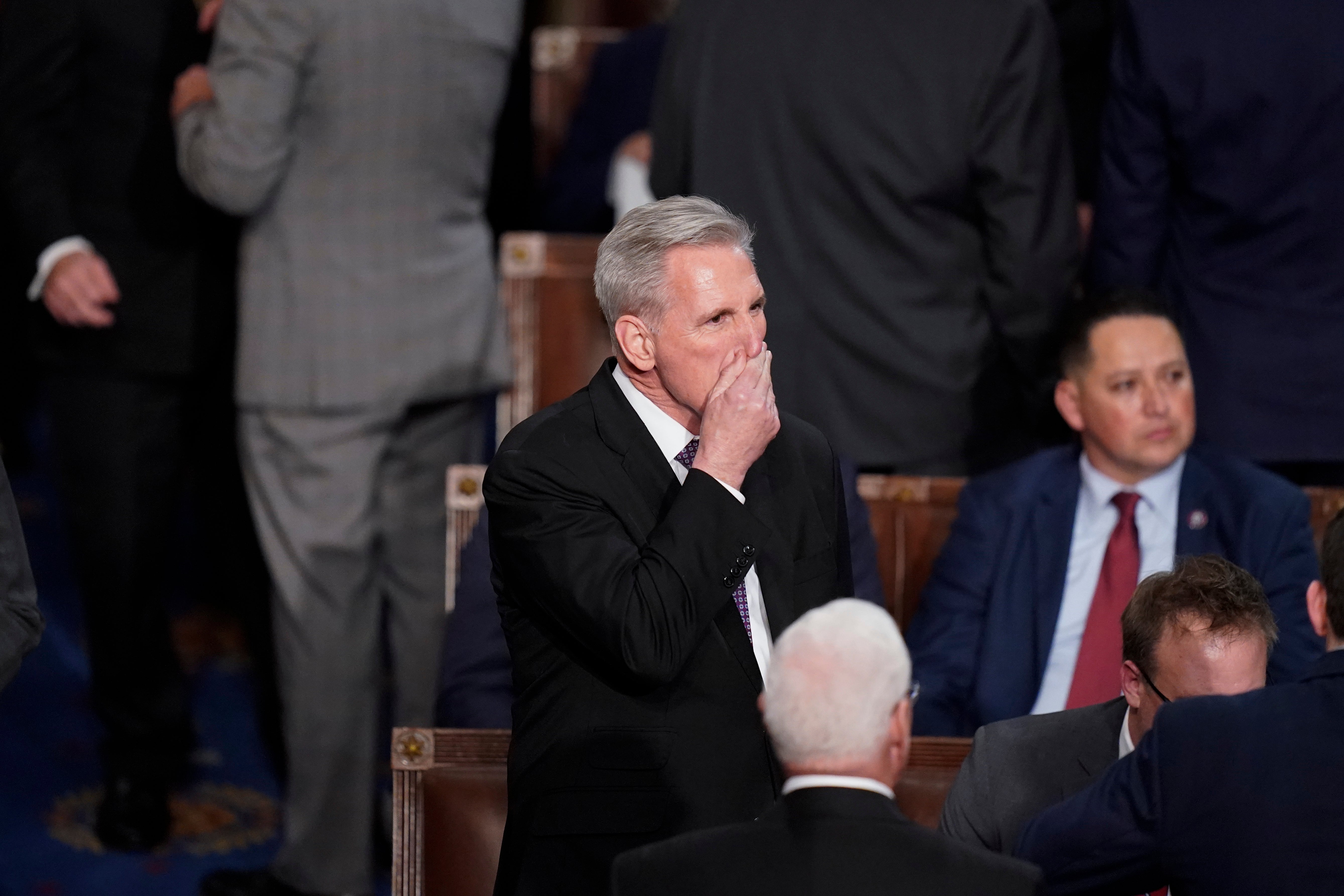 Rep Kevin McCarthy arrives to the House chamber at the beginning of an evening session after six failed attempts to vote him in as speaker