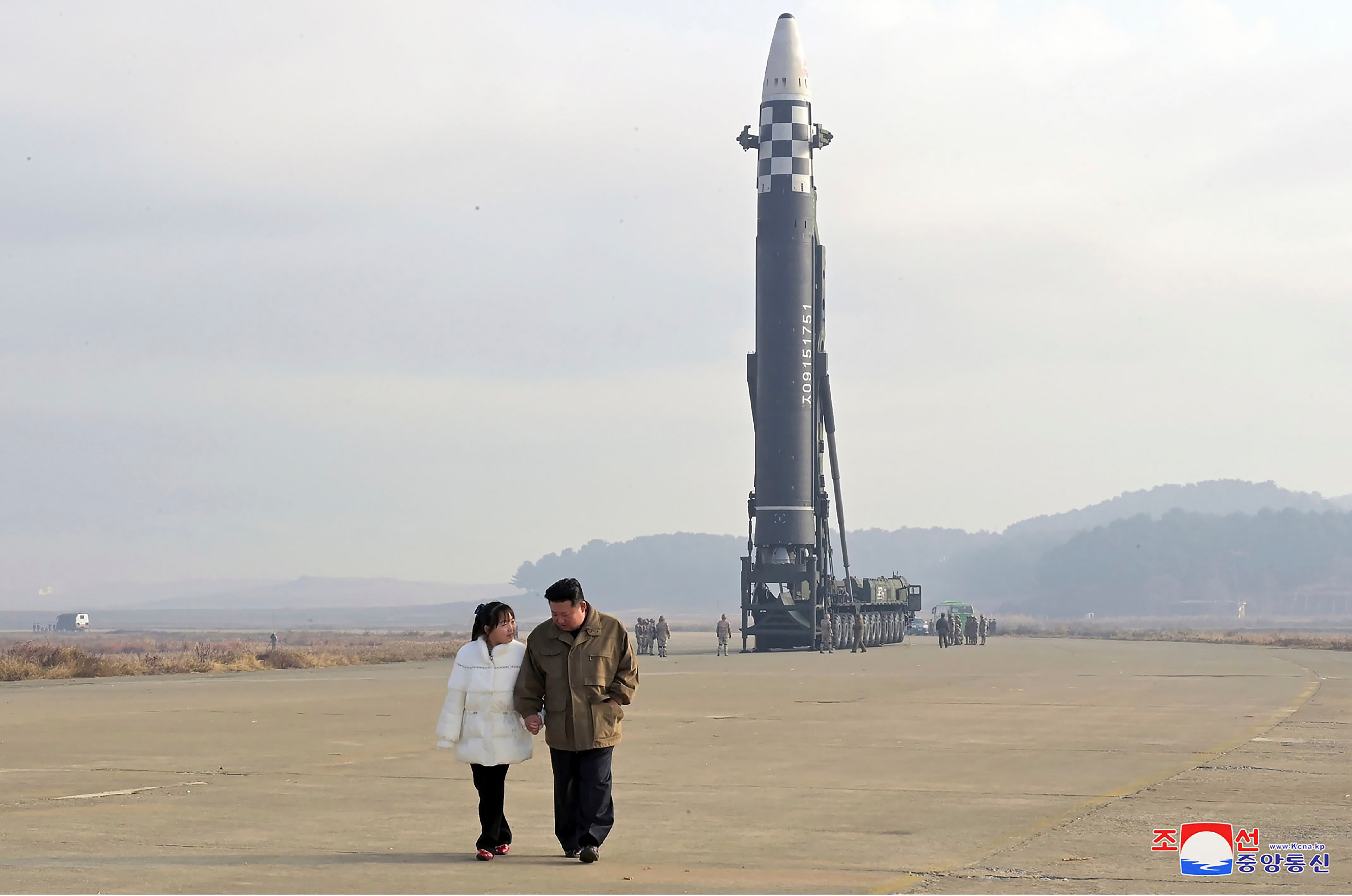 North Korea’s Kim Jong-un and his daughter oversee an ICBM missile test, in images released by state media