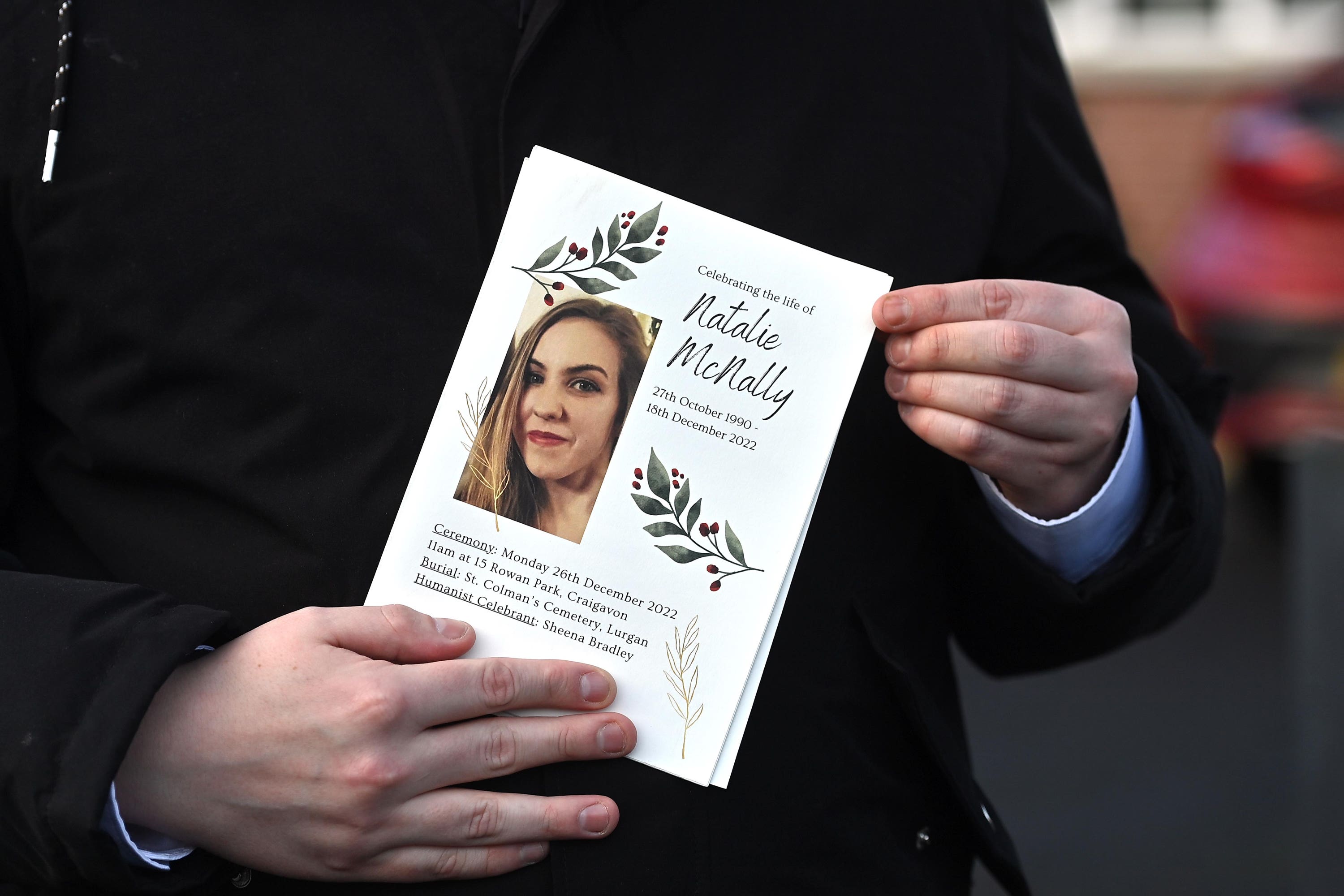 A mourner holds a order of service during the funeral of murder victim Natalie McNally at her parents home in Lurgan in County Armagh, Northern Ireland. Ms McNally 32, who was 15 weeks pregnant with a boy, was fatally stabbed at her home in Lurgan last Sunday. Picture date: Monday December 26, 2022.