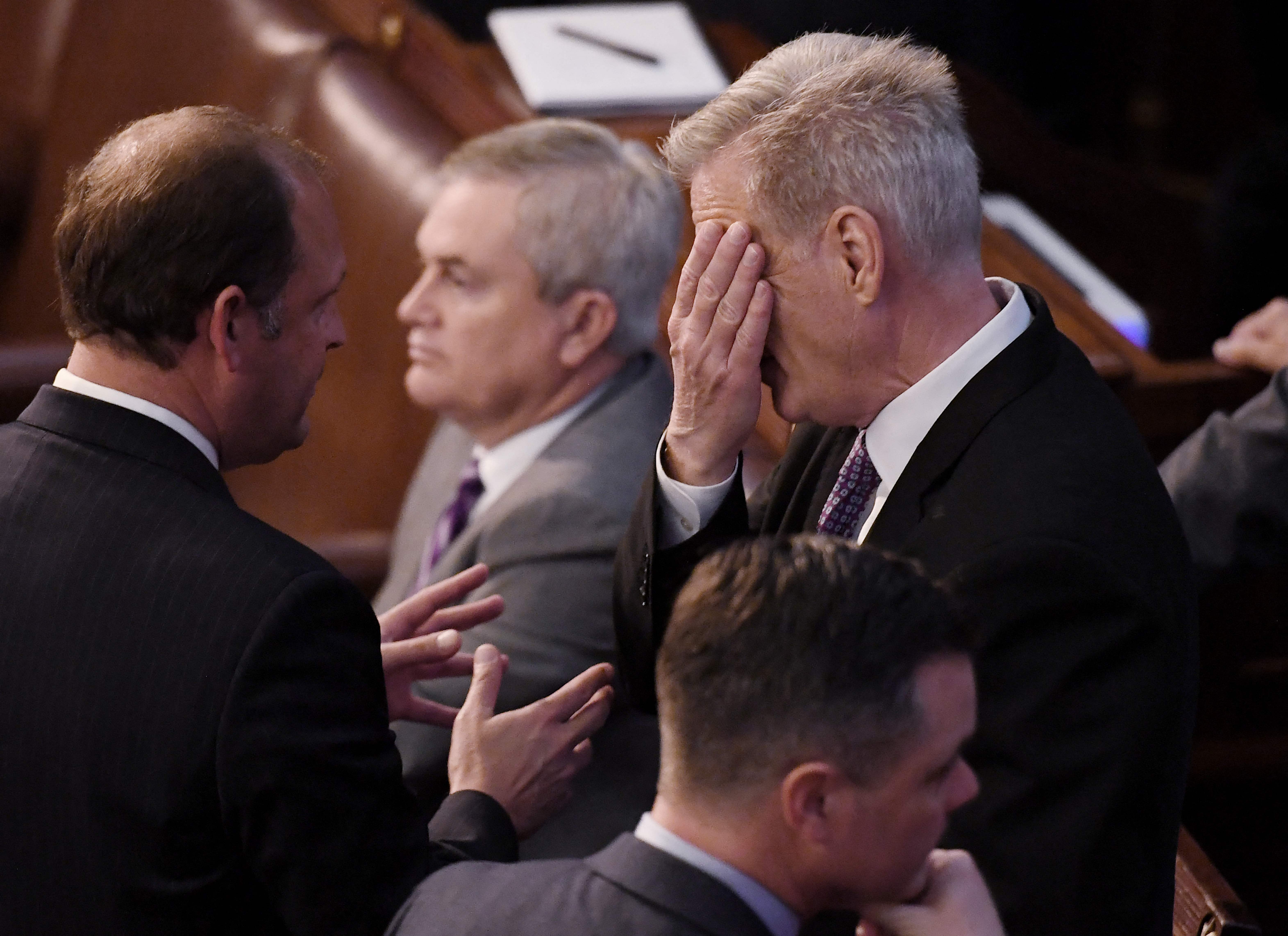 Republican Representative from California Kevin McCarthy, right, speaks with a colleague as the US House of Representatives continues voting for new speaker at the US Capitol in Washington DC