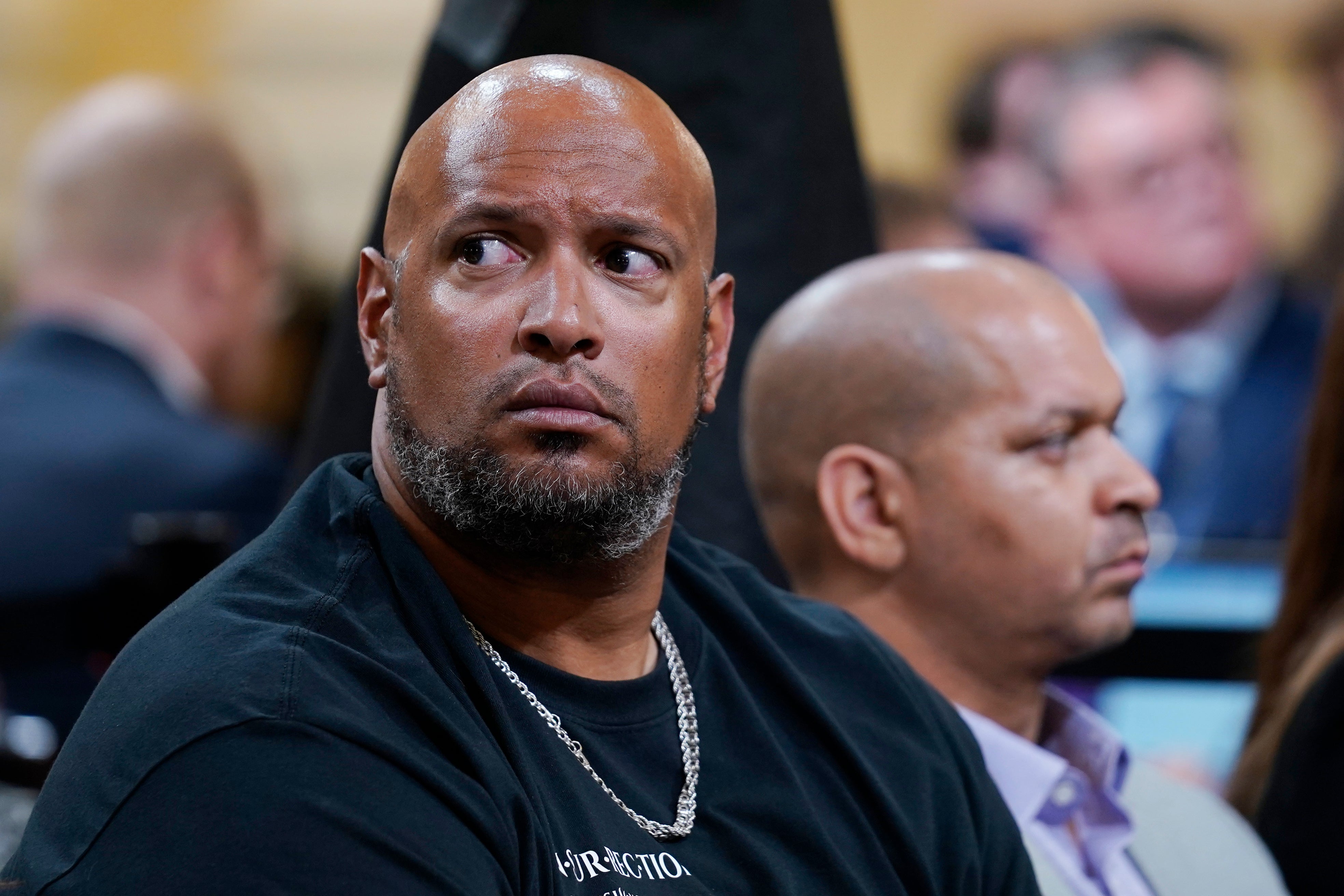 Former US Capitol Police officer Harry Dunn, left, and former sergeant Aquilino Gonell, right, were hissed and booed at while at the Pennsylvania statehouse this week