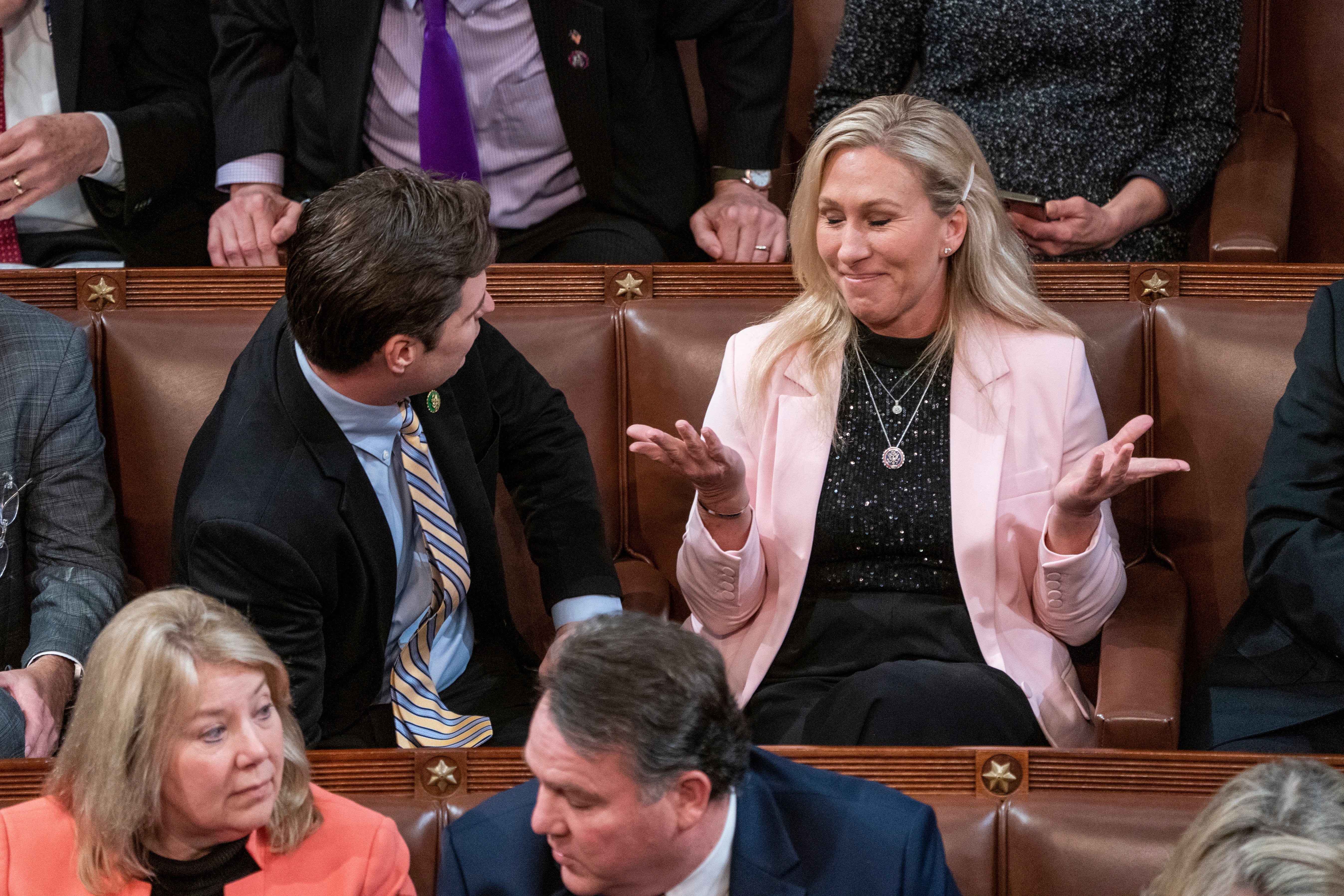 Matt Gaetz talks with Marjorie Taylor Greene. Usually firm allies, the two have found themselves on opposing sides of the battle for speaker, with Gaetz firmly against McCarthy and Greene firmly for him.