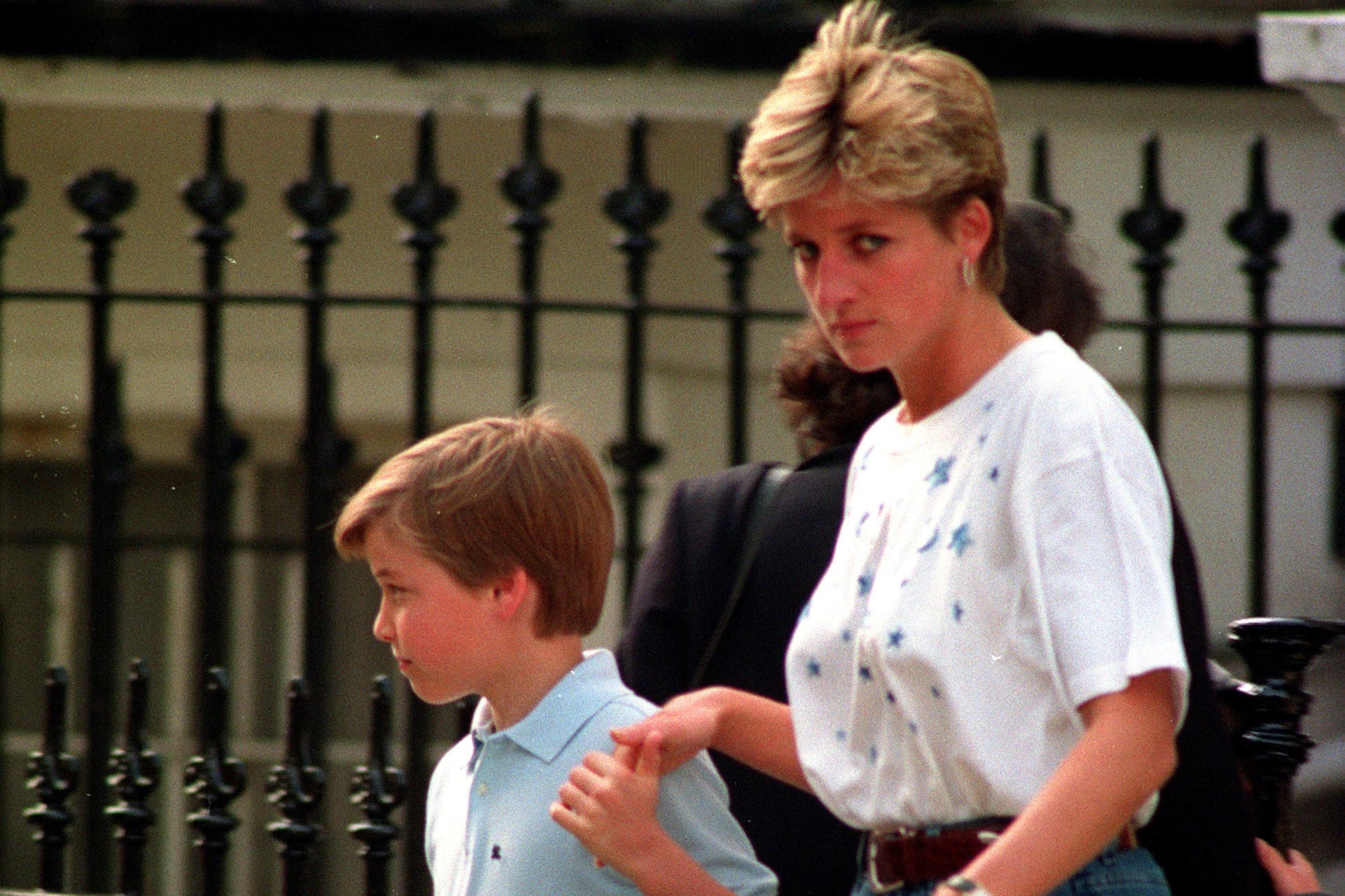 Diana, Princess of Wales, holds a young Prince William’s hand (Adam Butler/PA)