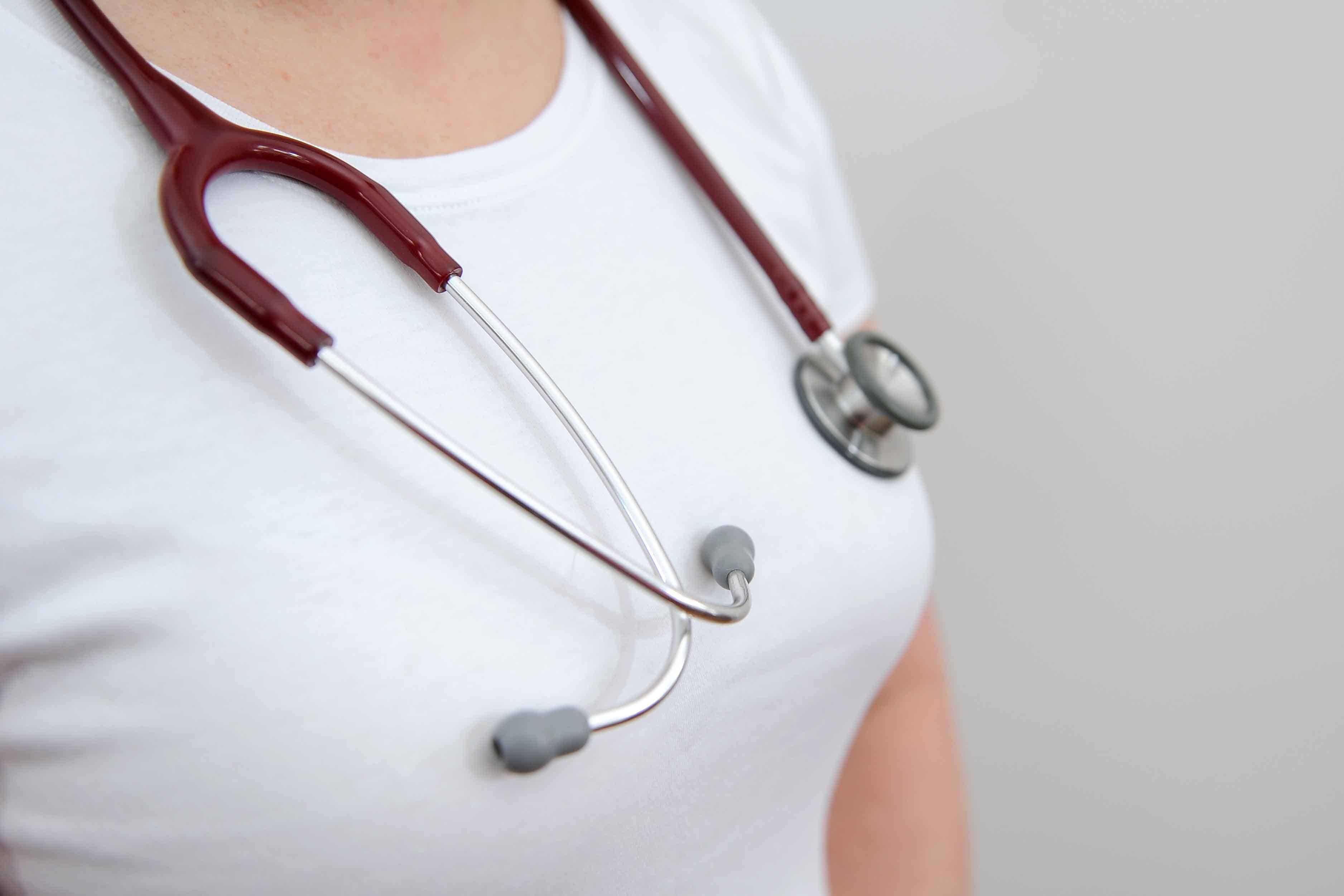 A woman poses with a Stethoscope around the neck (Andrew Matthews/PA)