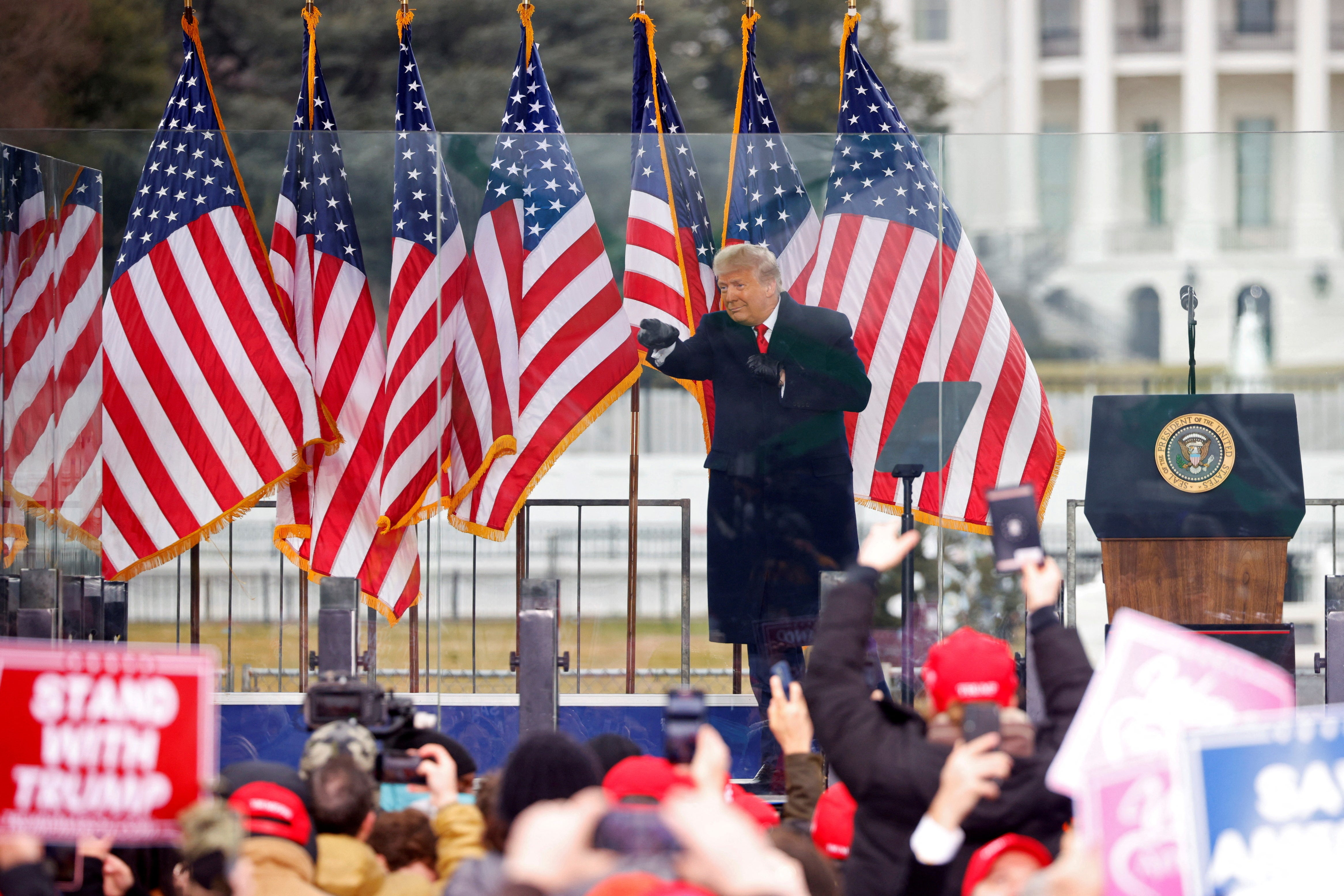 Donald Trump gestures at the end of his speech during a rally to contest the certification of the 2020 election results on the day of the insurrection