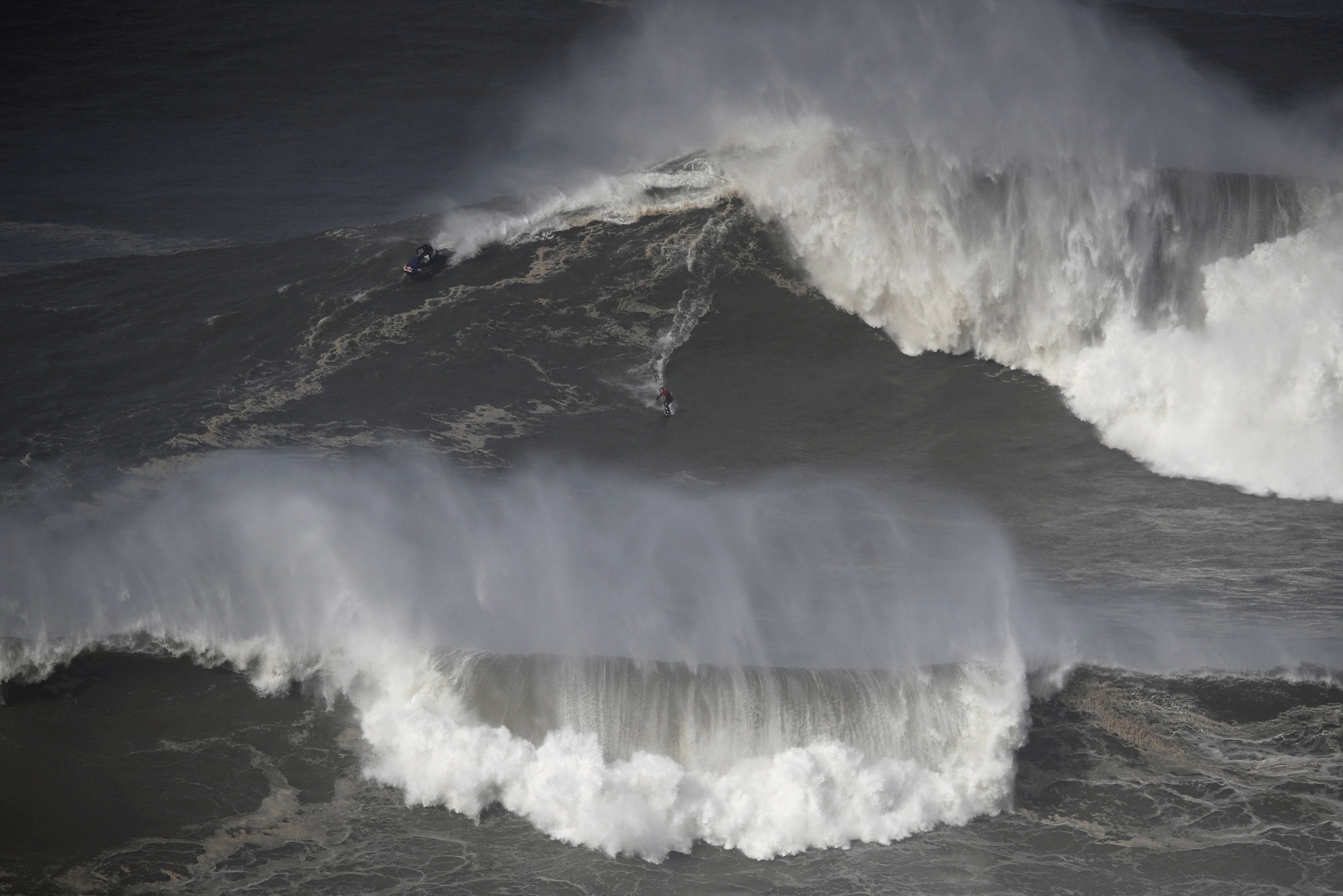 A surfer rides a wave in Nazare, Portugal in February 2022. Marcio Freire died surfing there on Thursday