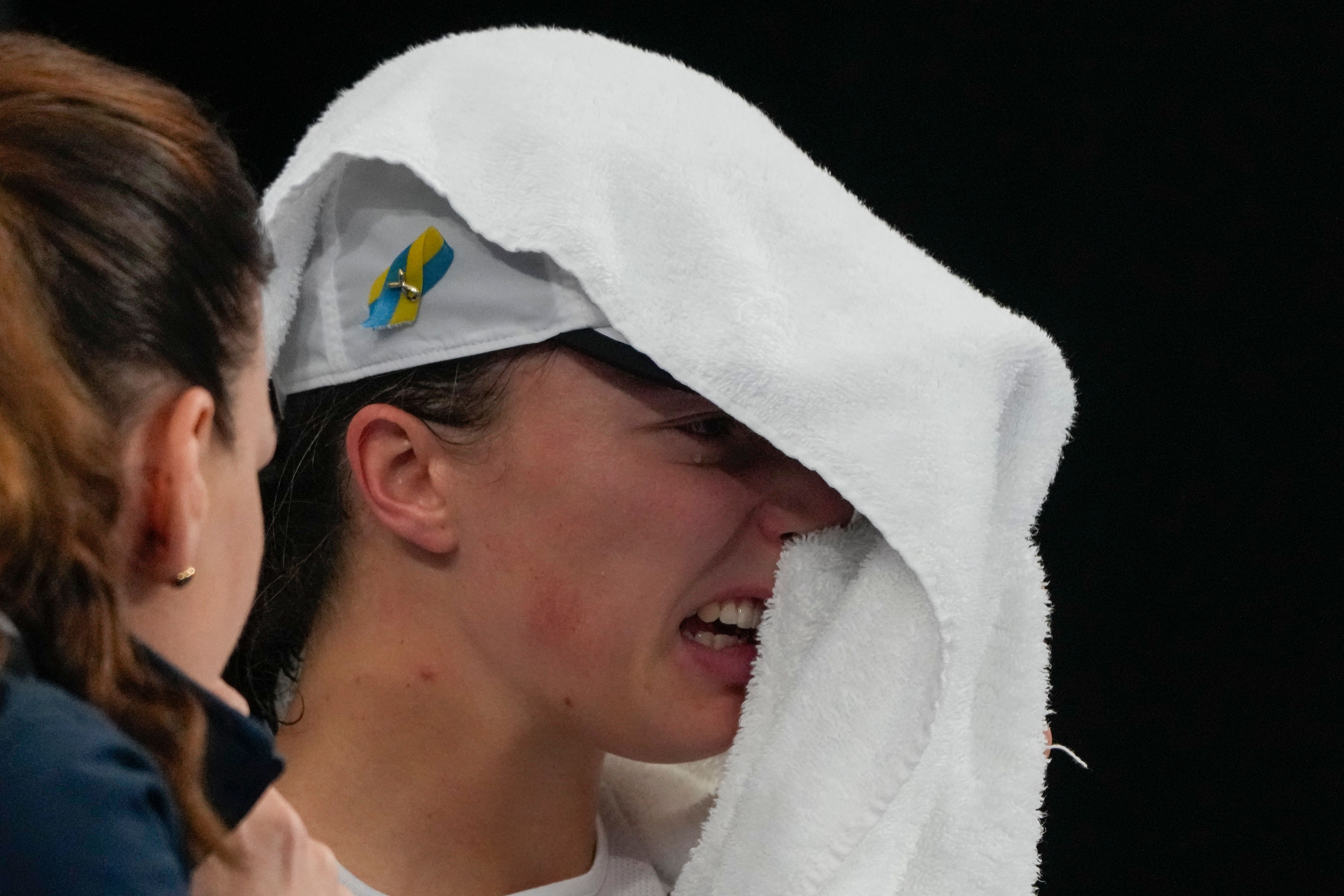 Iga Swiatek shows her emotions after losing to Jessica Pegula (Mark Baker/AP)