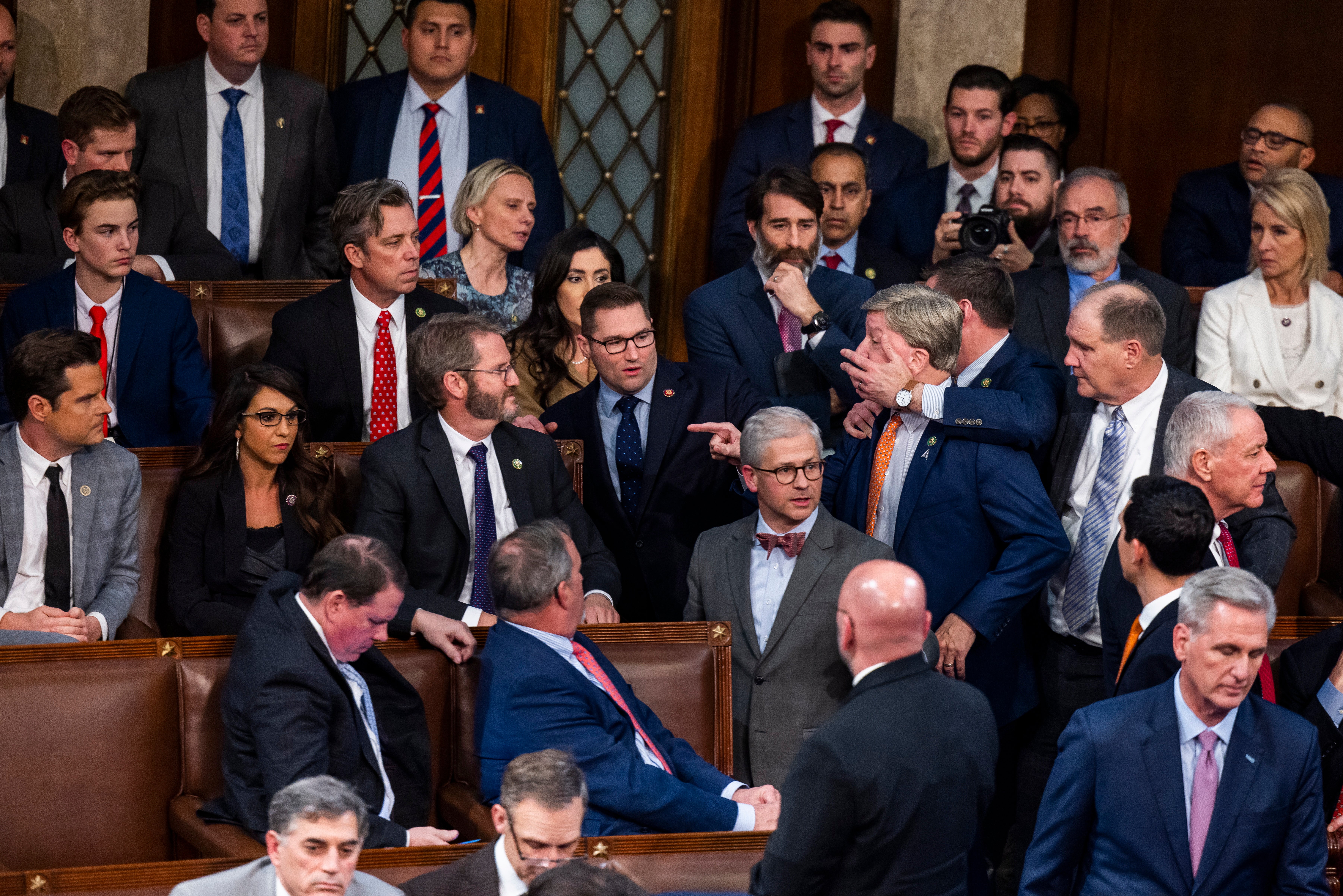 Alabama Rep Mike Rogers is restrained after yelling at Florida’s Matt Gaetz after his repeated refusal to back Kevin McCarthy on 6 January.