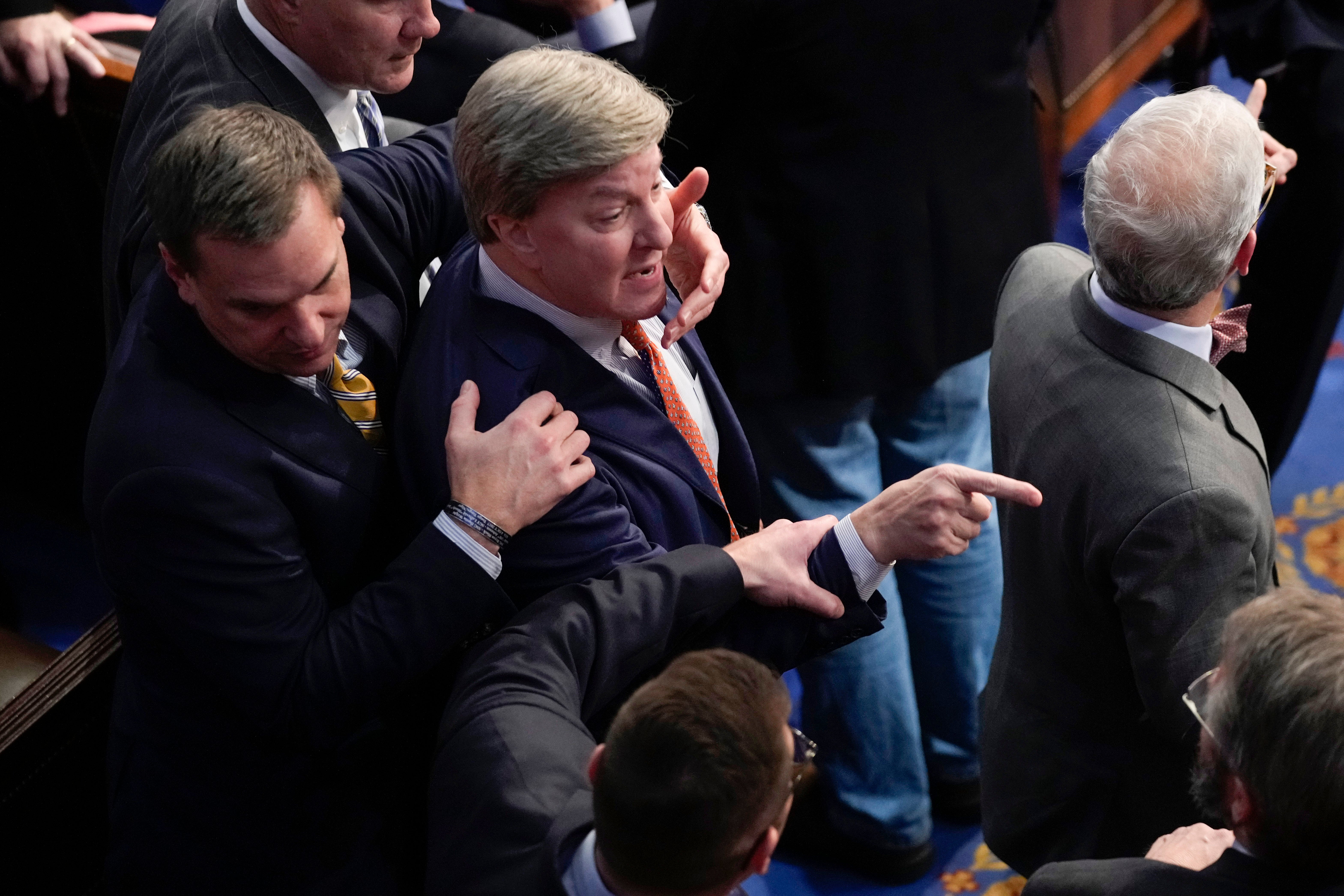 Alabama Republican Mike Rogers is restrained after confronting Matt Gaetz.