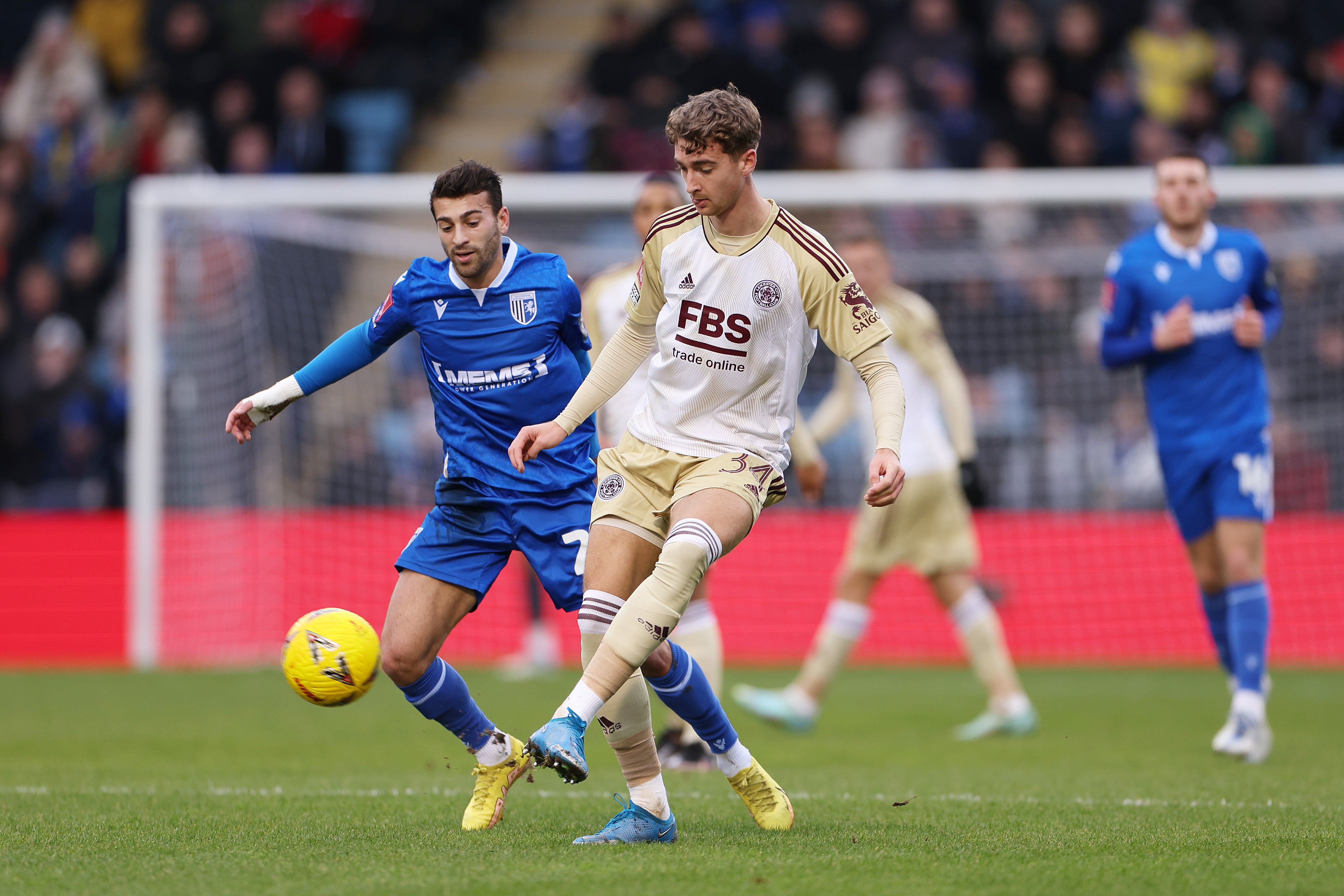 Lewis Brunt of Leicester City controls the ball whilst under pressure from Scott Kashket of Gillingham