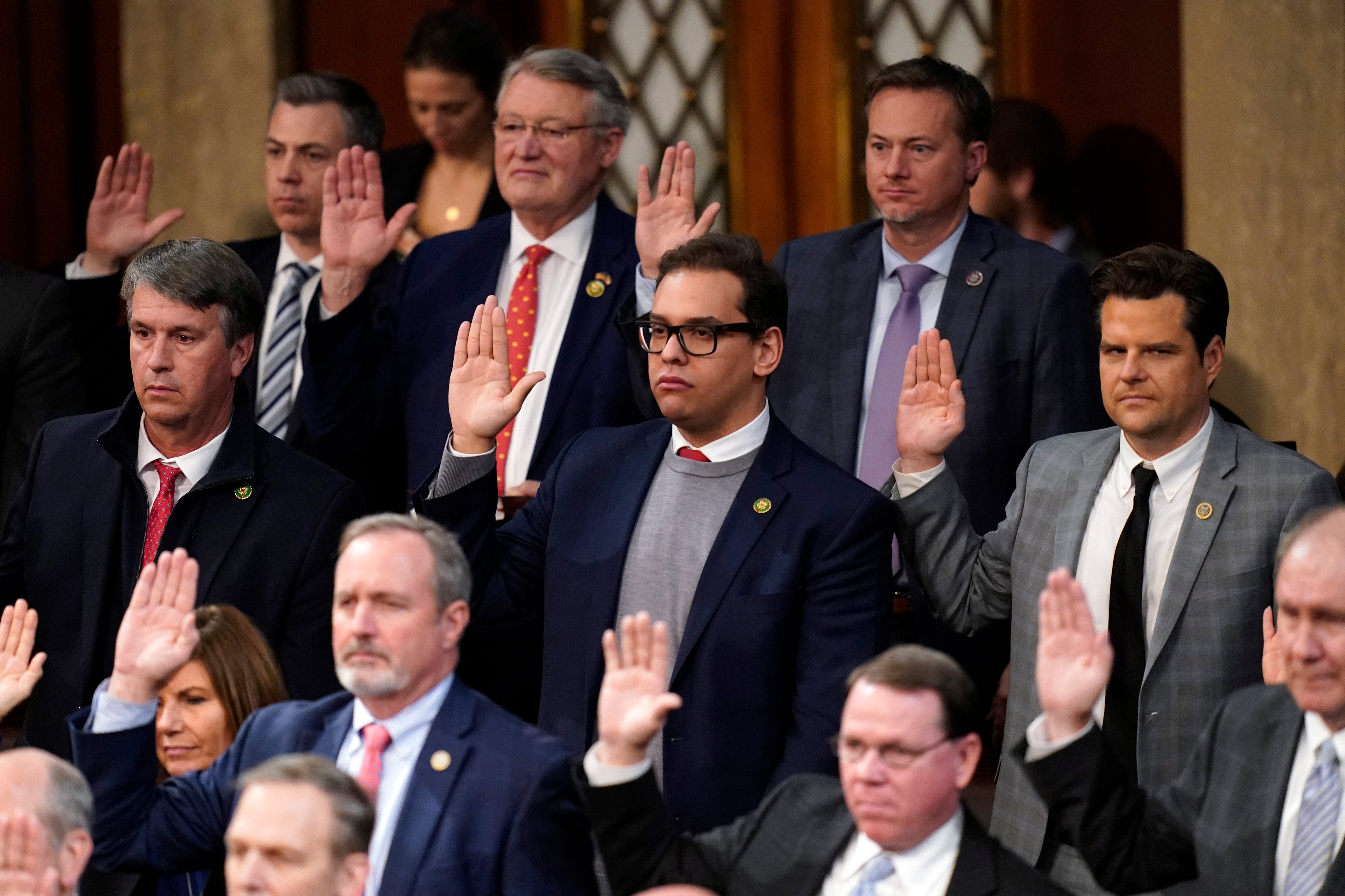 George Santos, centre, is sworn in alongside his new colleagues