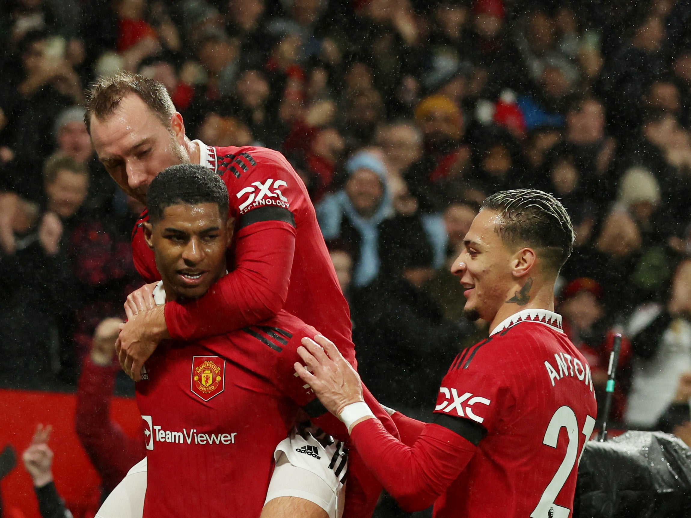 Marcus Rashford celebrates scoring with Christian Eriksen and Antony