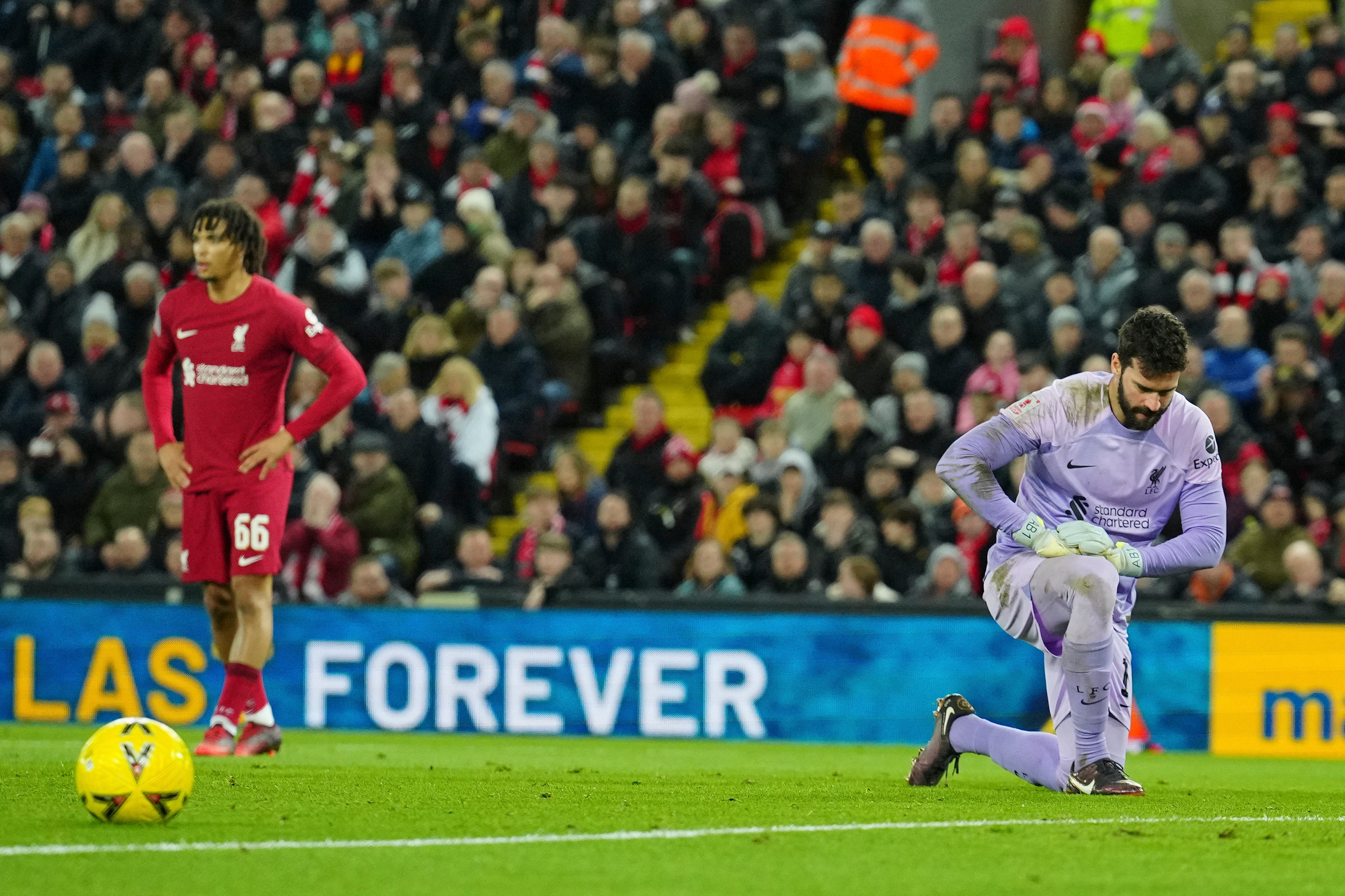 Liverpool’s goalkeeper Alisson reacts after conceding the opening goal