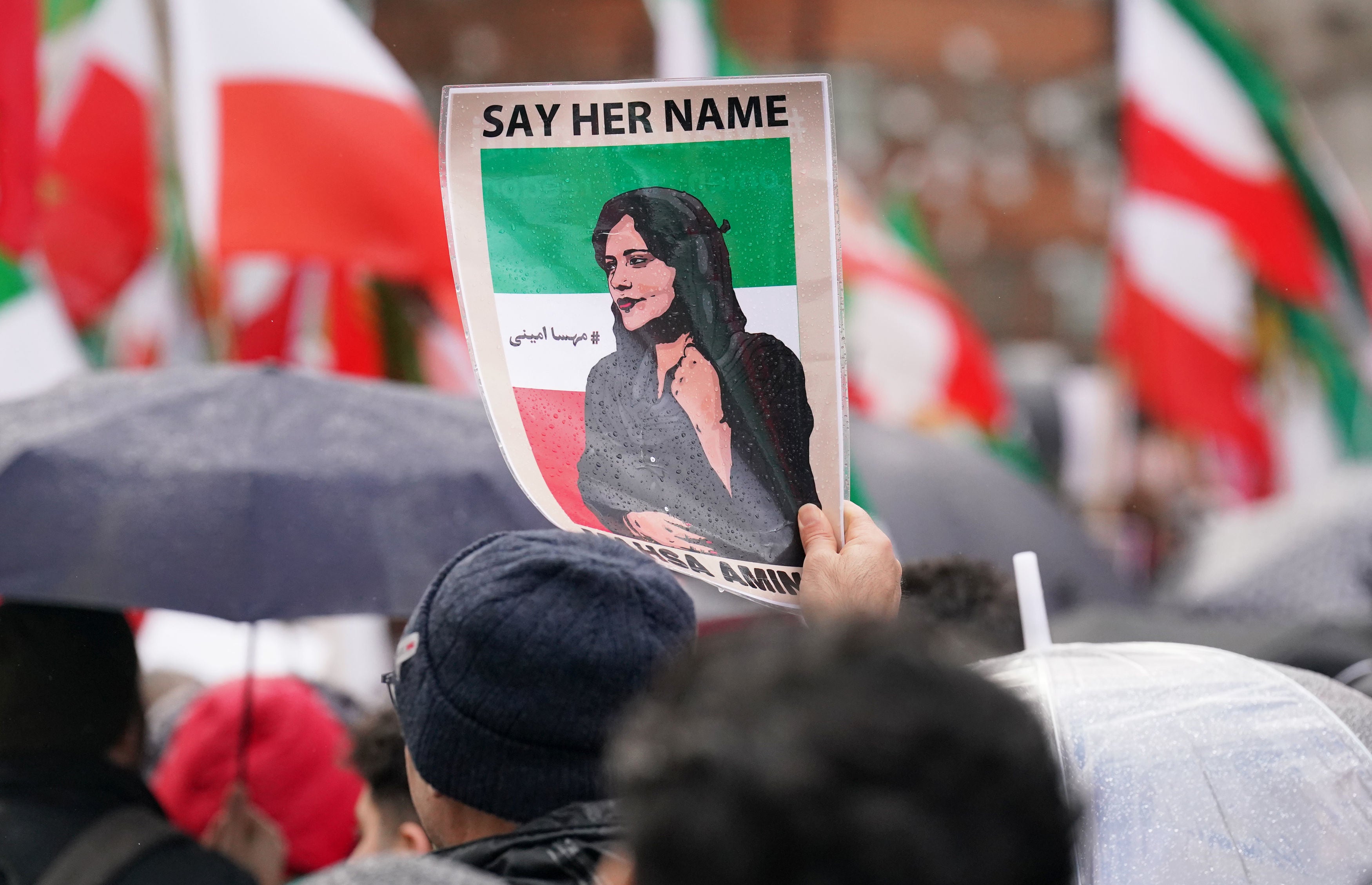 A banner bearing the face of 22-year-old Masha Amini