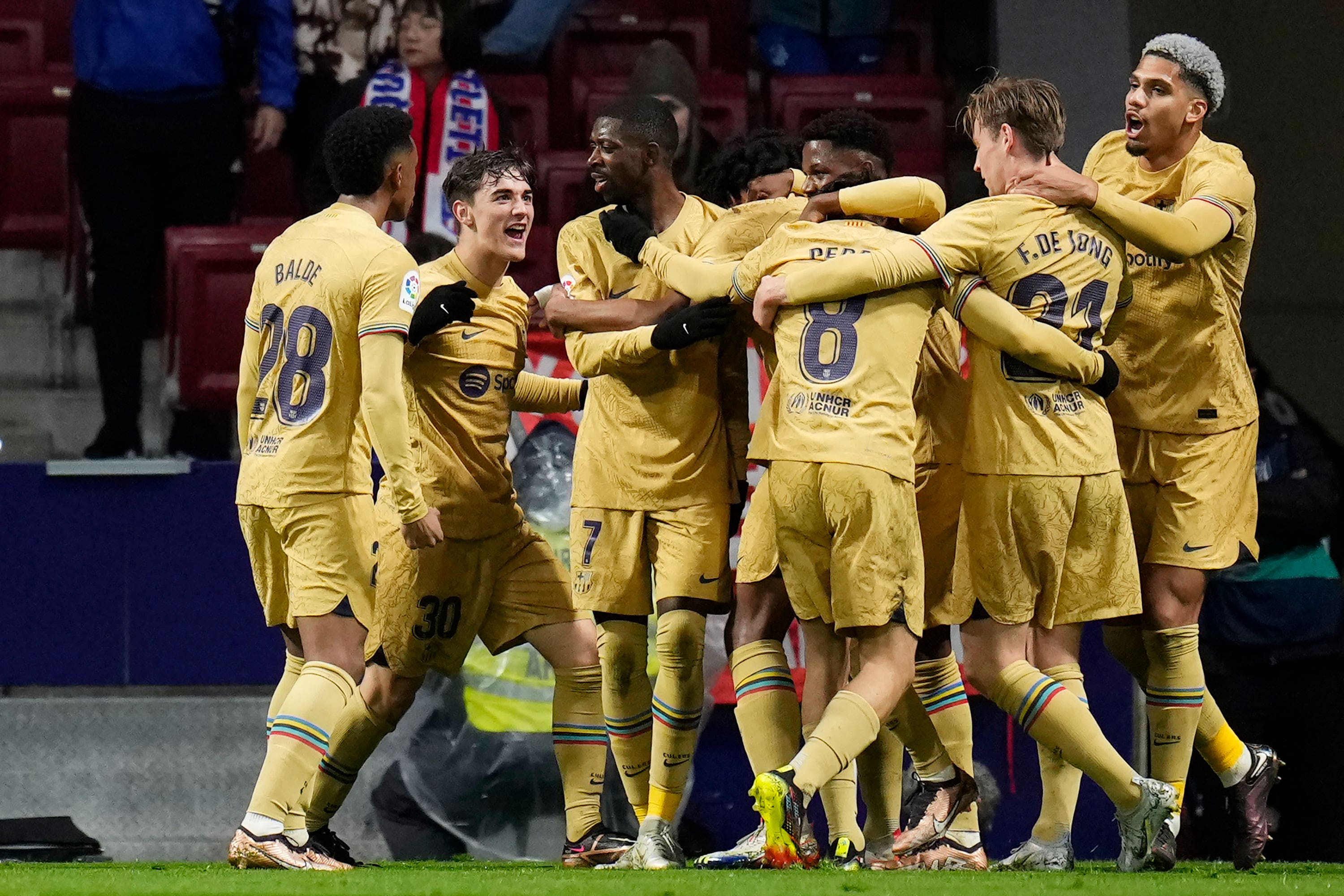 Barcelona’s Ousmane Dembele (third from left) celebrates with teammates after scoring the against Atletico Madrid (Manu Fernandez/AP).