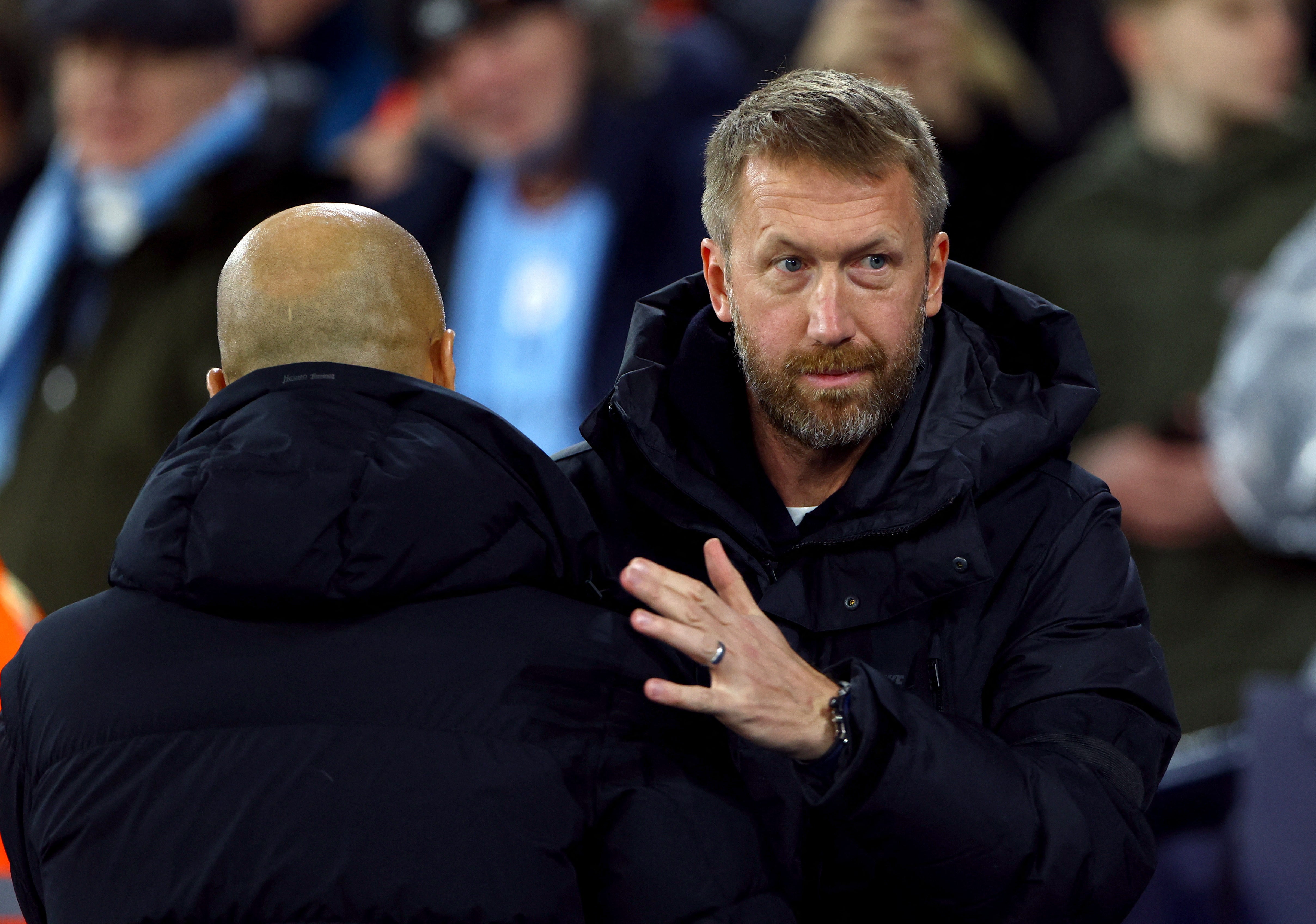 Graham Potter and Pep Guardiola embrace before Sunday’s match