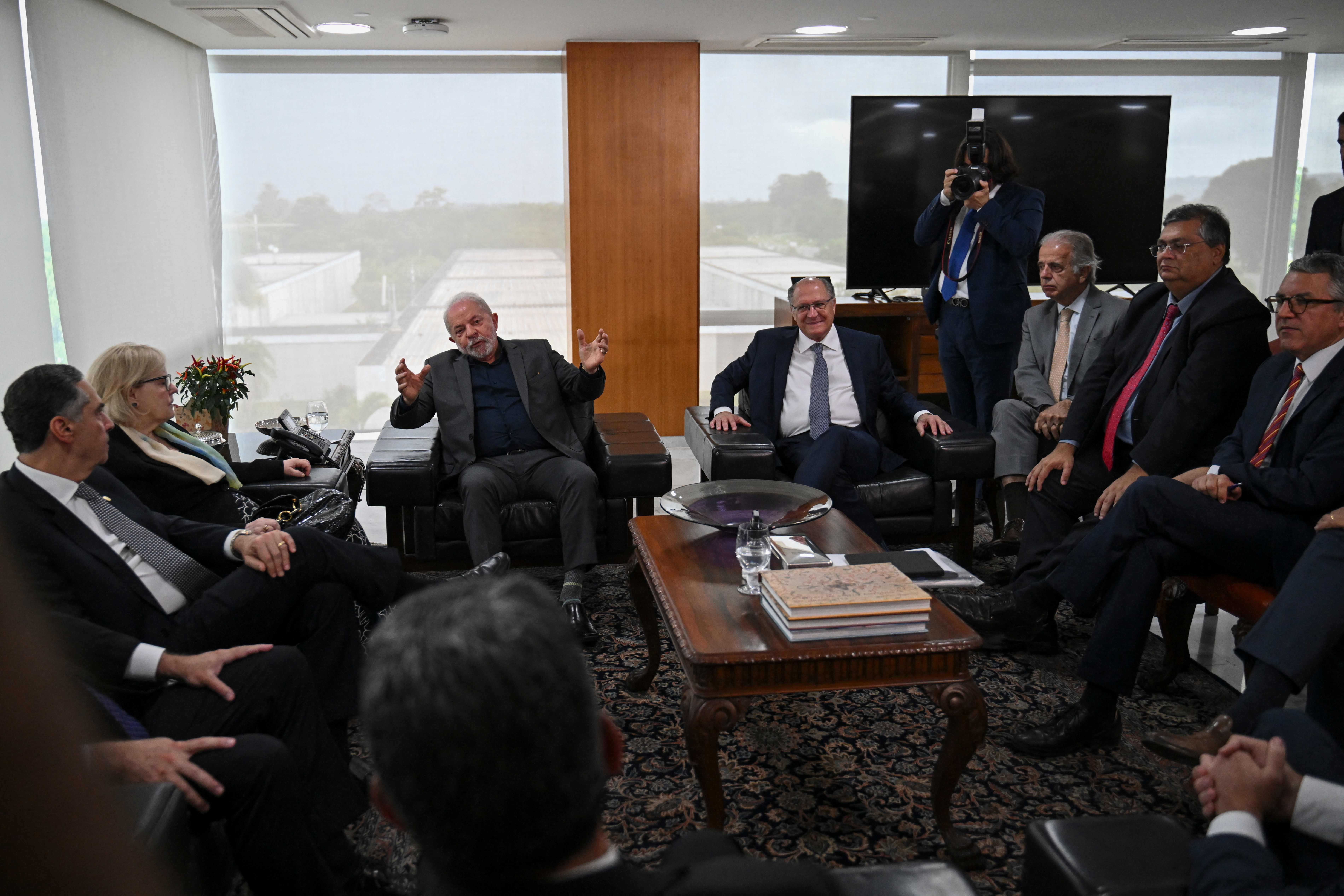 Brazil's President Luiz Inacio Lula Da Silva, centre left, meets with Supreme Court ministers and his cabinet at Planalto Presidential Palace in Brasilia