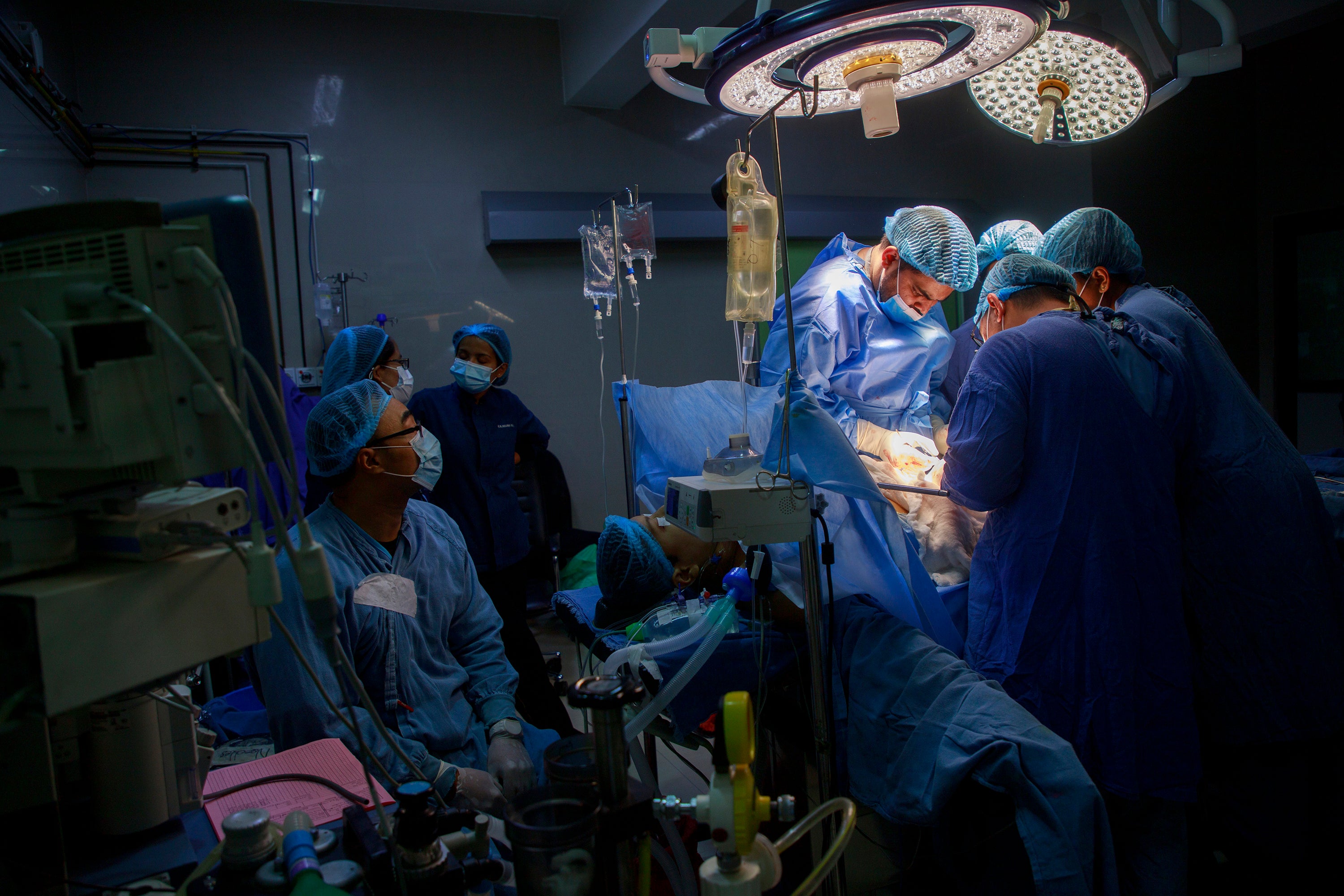 A team of surgeons led by Pukar Chandra Shrestha performs a kidney transplant surgery