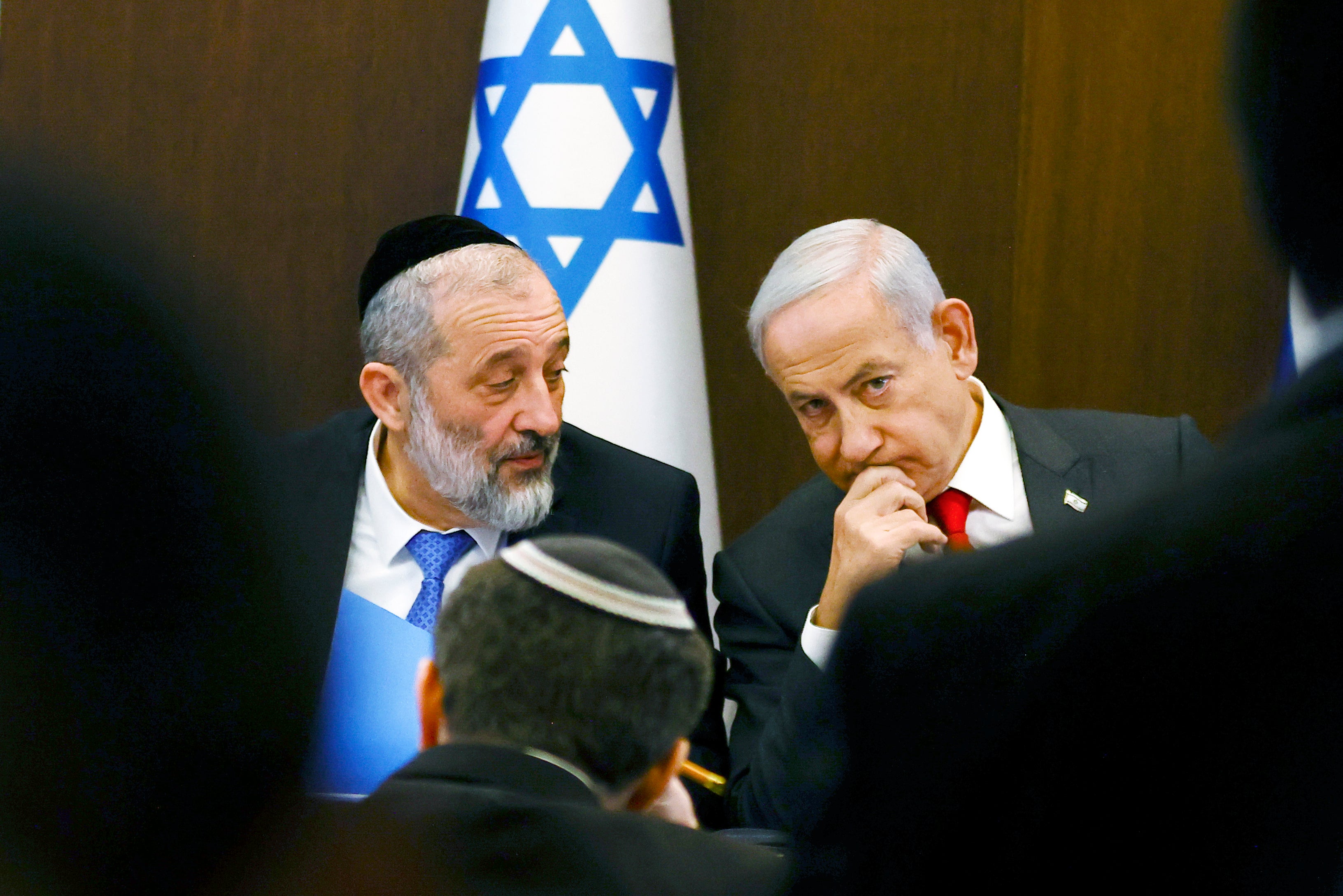 Israeli Prime Minister Benjamin Netanyahu, right, speaks with Aryeh Deri