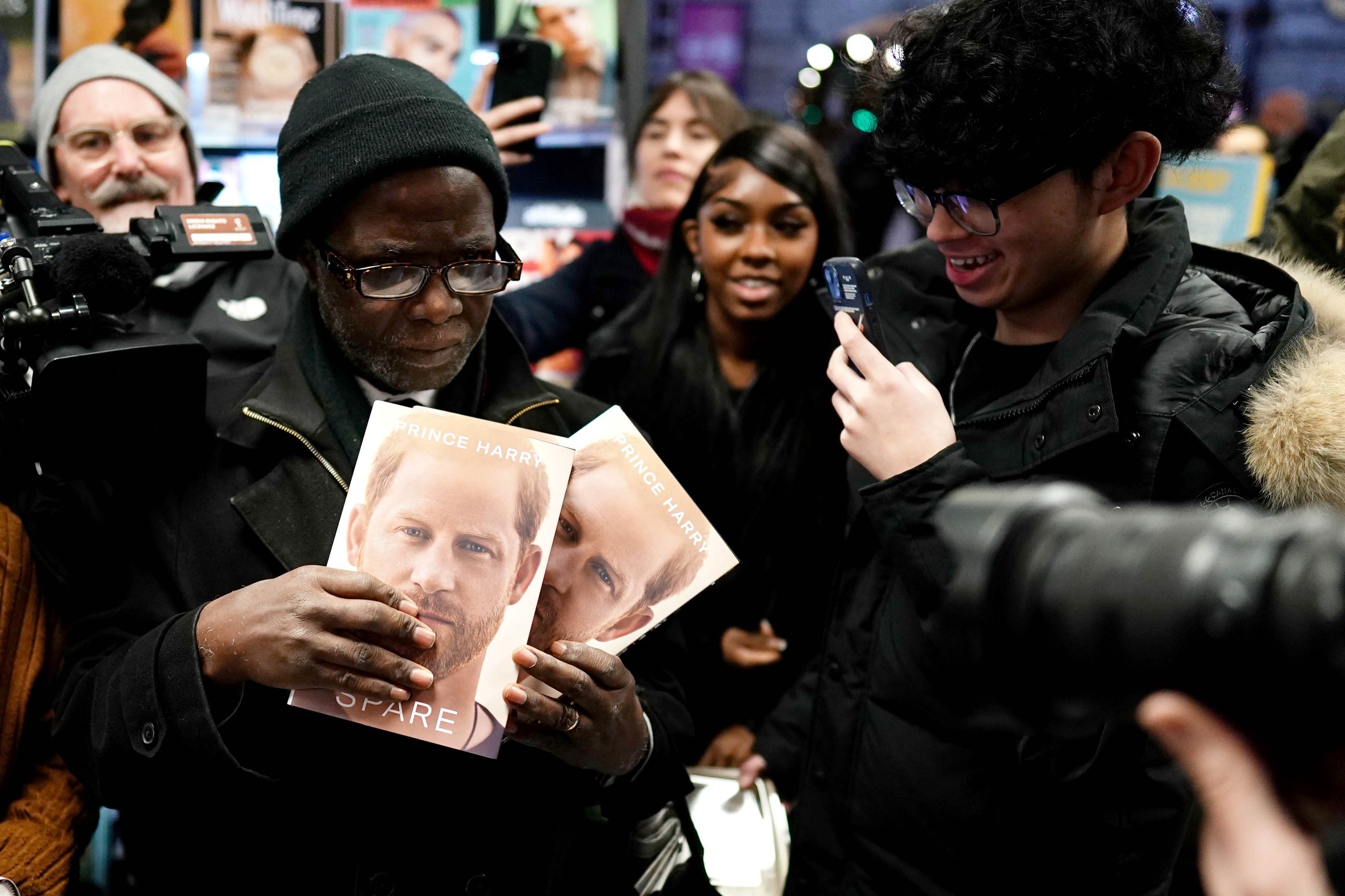 Professor Chris Imafidon, chairman of the Excellence in Education charity, from Epping, Essex, who was first in line at WH Smiths in Victoria Station. (PA)