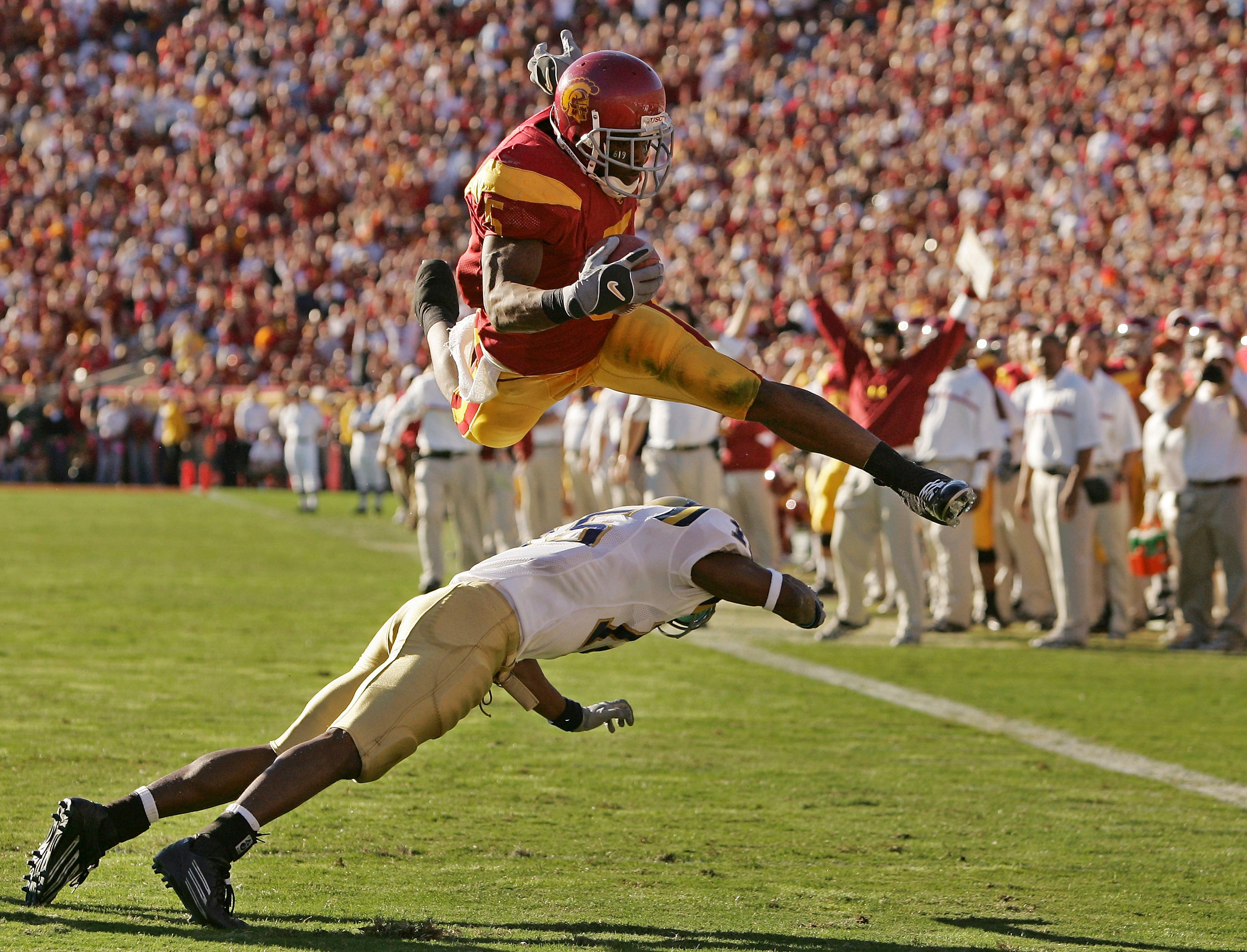 College football officials accused Bush of accepting cash benefits and travel expenses during his USC playing career