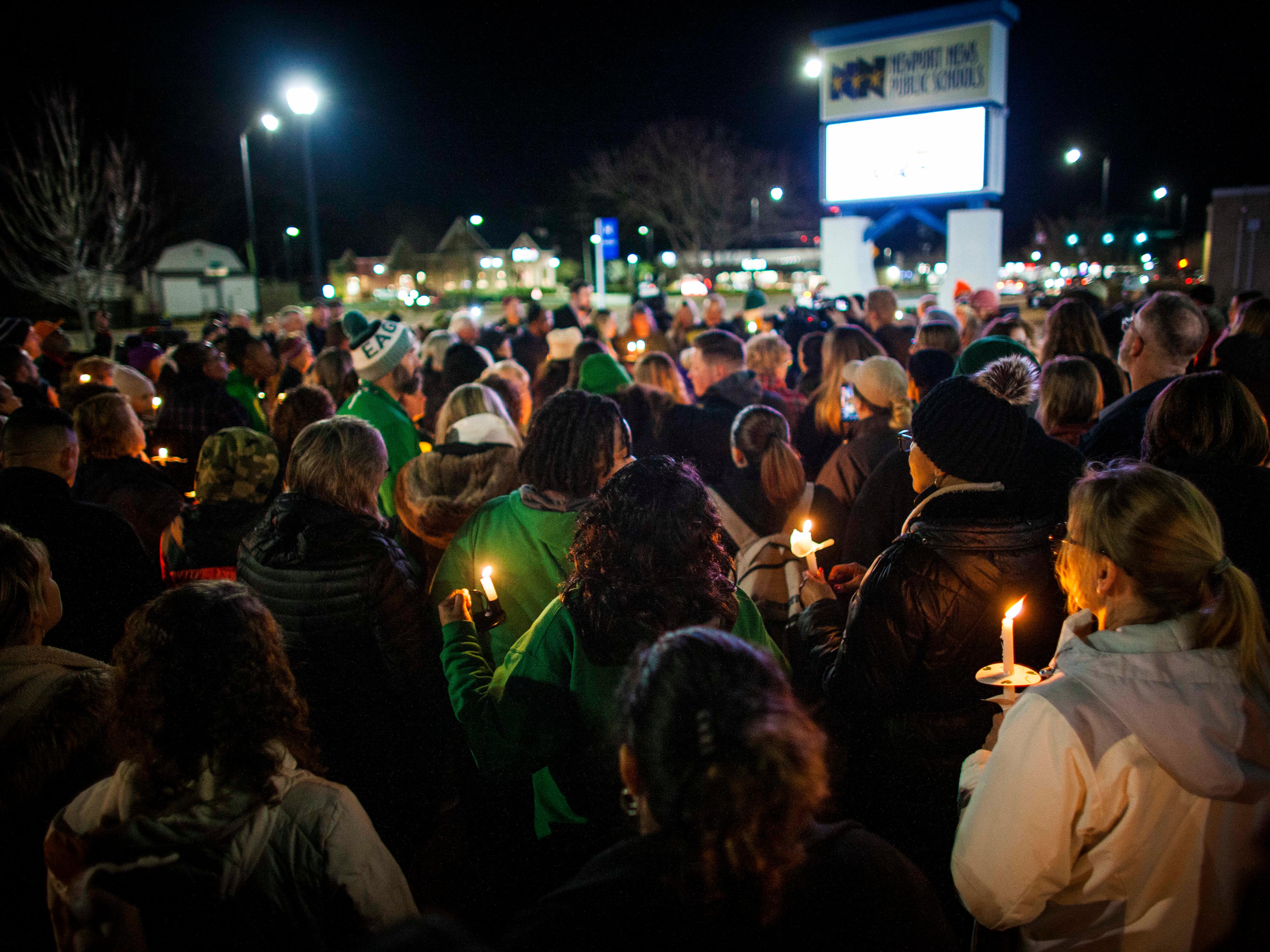 Residents of Newport News hold a candlelight vigil in honor of Richneck Elementary School first-grade teacher Abby Zwerner at the School Administration Building in Newport News, Va., Monday, Jan. 9, 2023