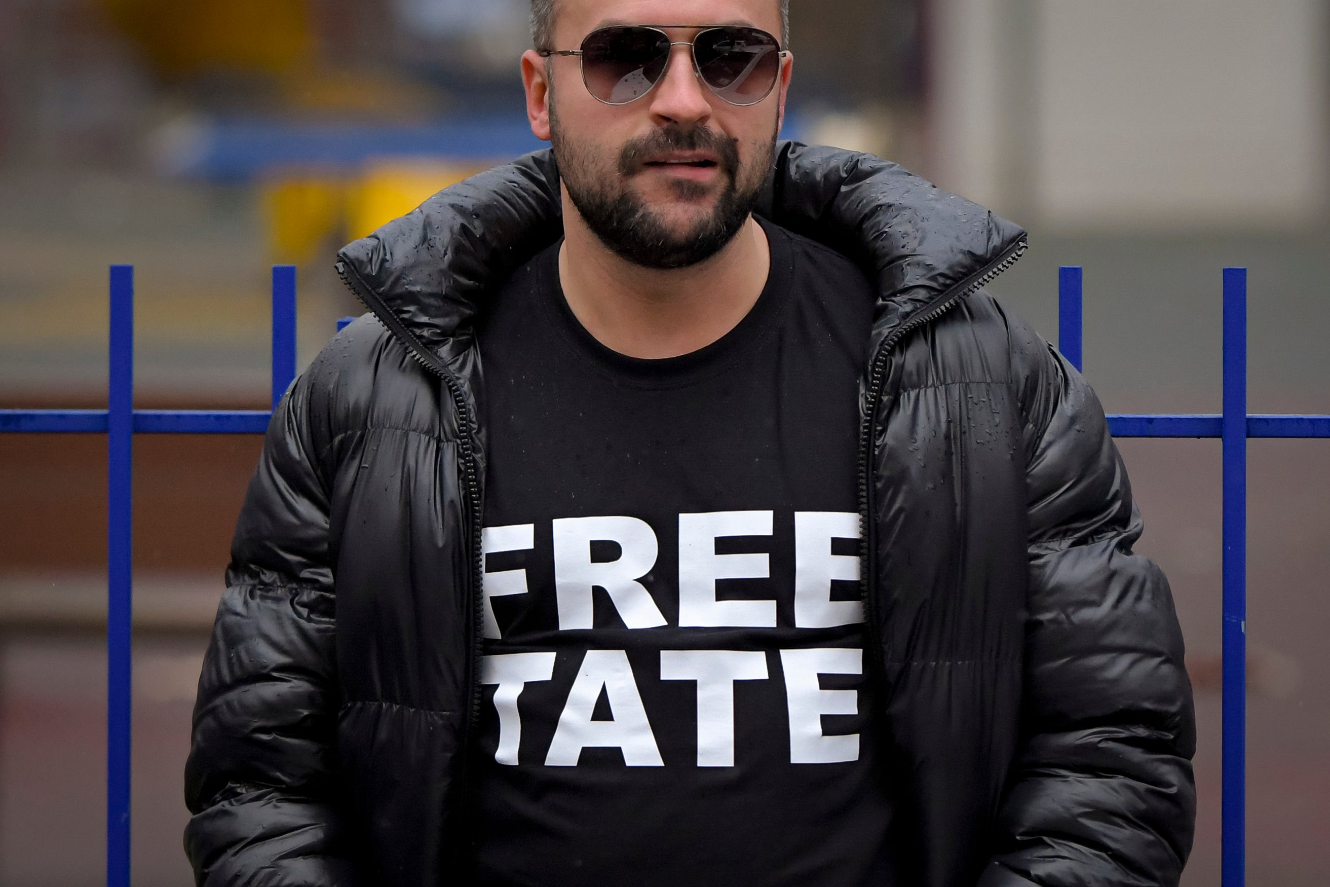 A man stands outside the Court of Appeal during the hearings for the Tate brothers