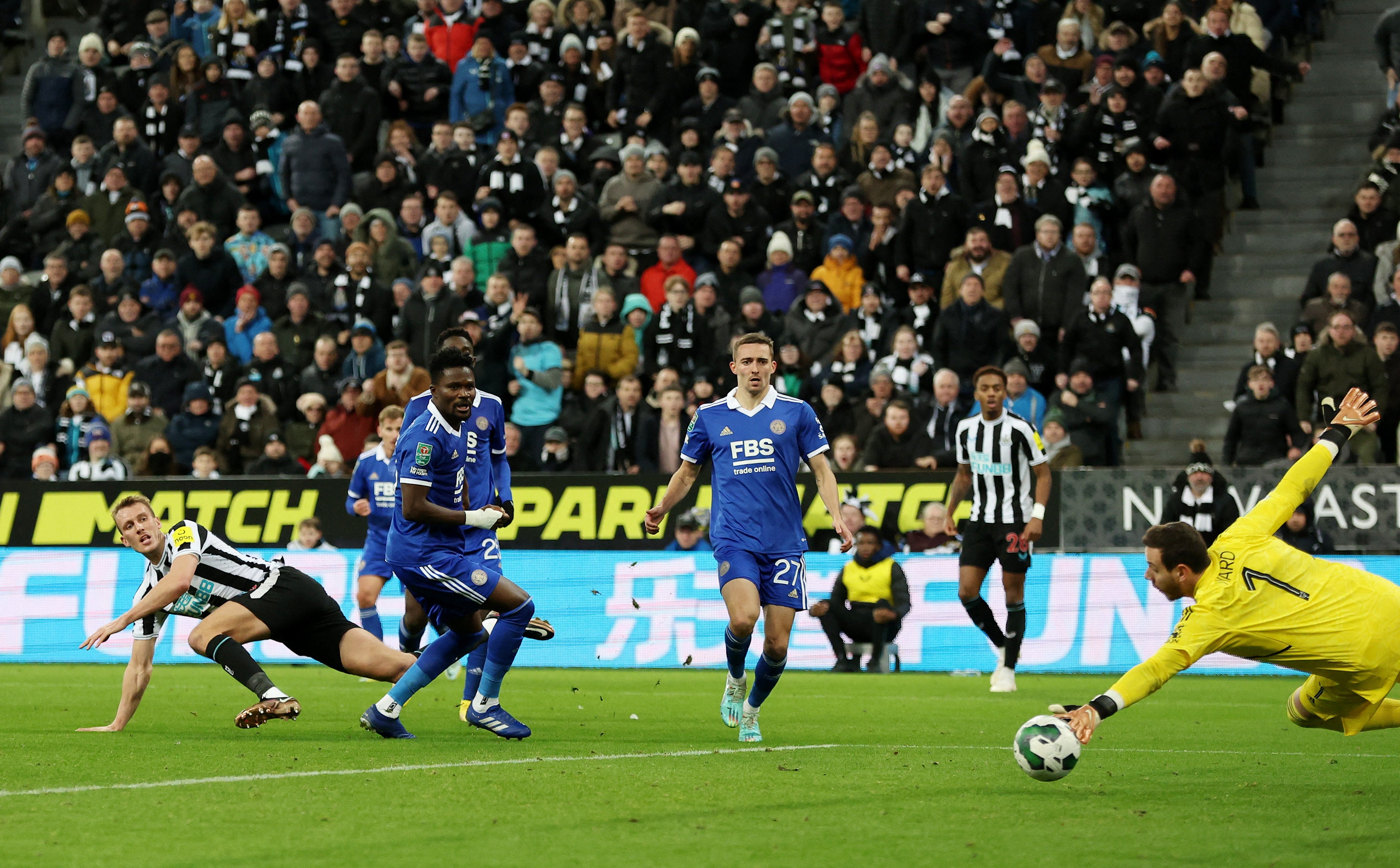 Dan Burn, left, watches his shot beat Leicester keeper Danny Ward