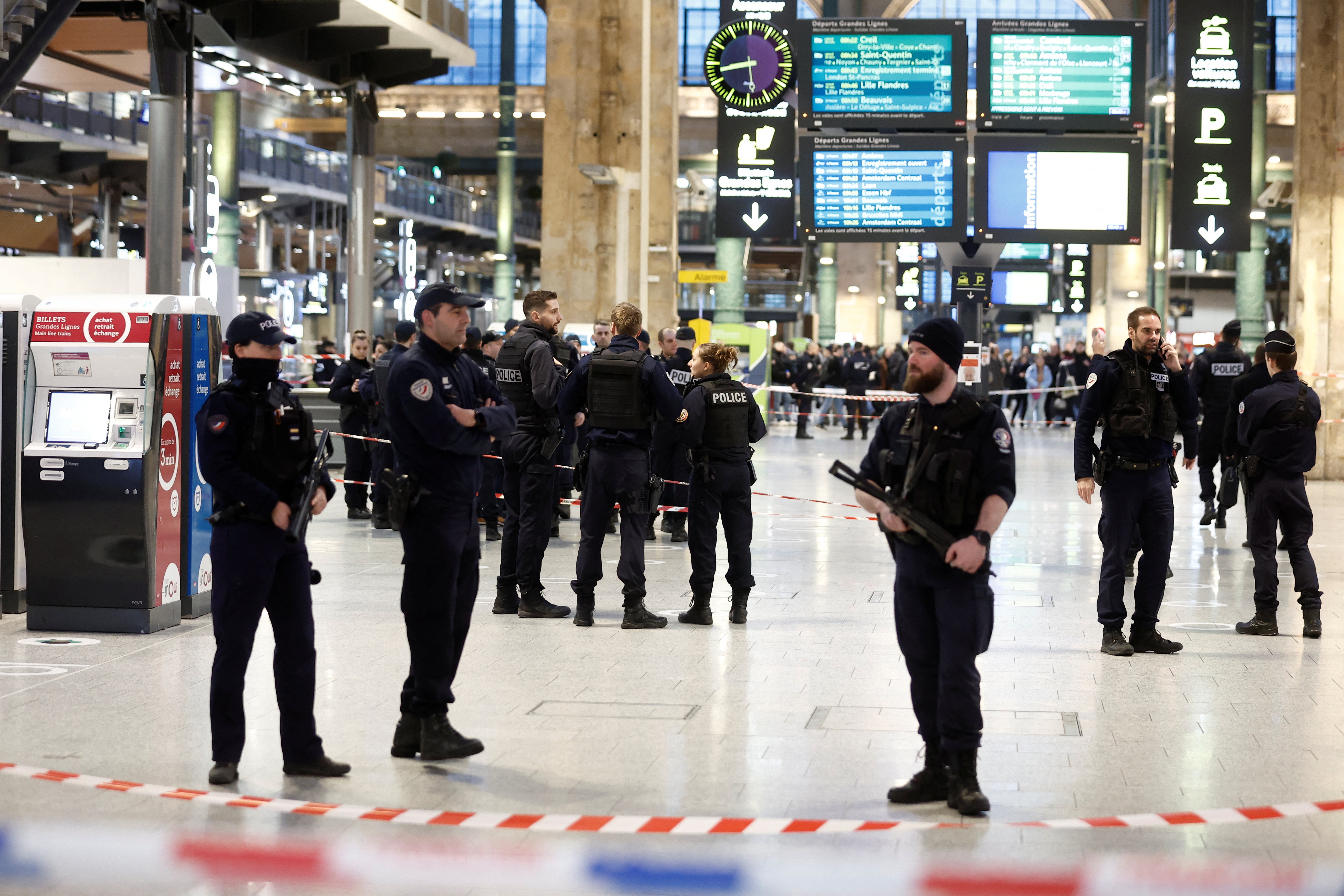 French police secure the area after a man with a knife wounded several people at the Gare du Nord train station in Paris