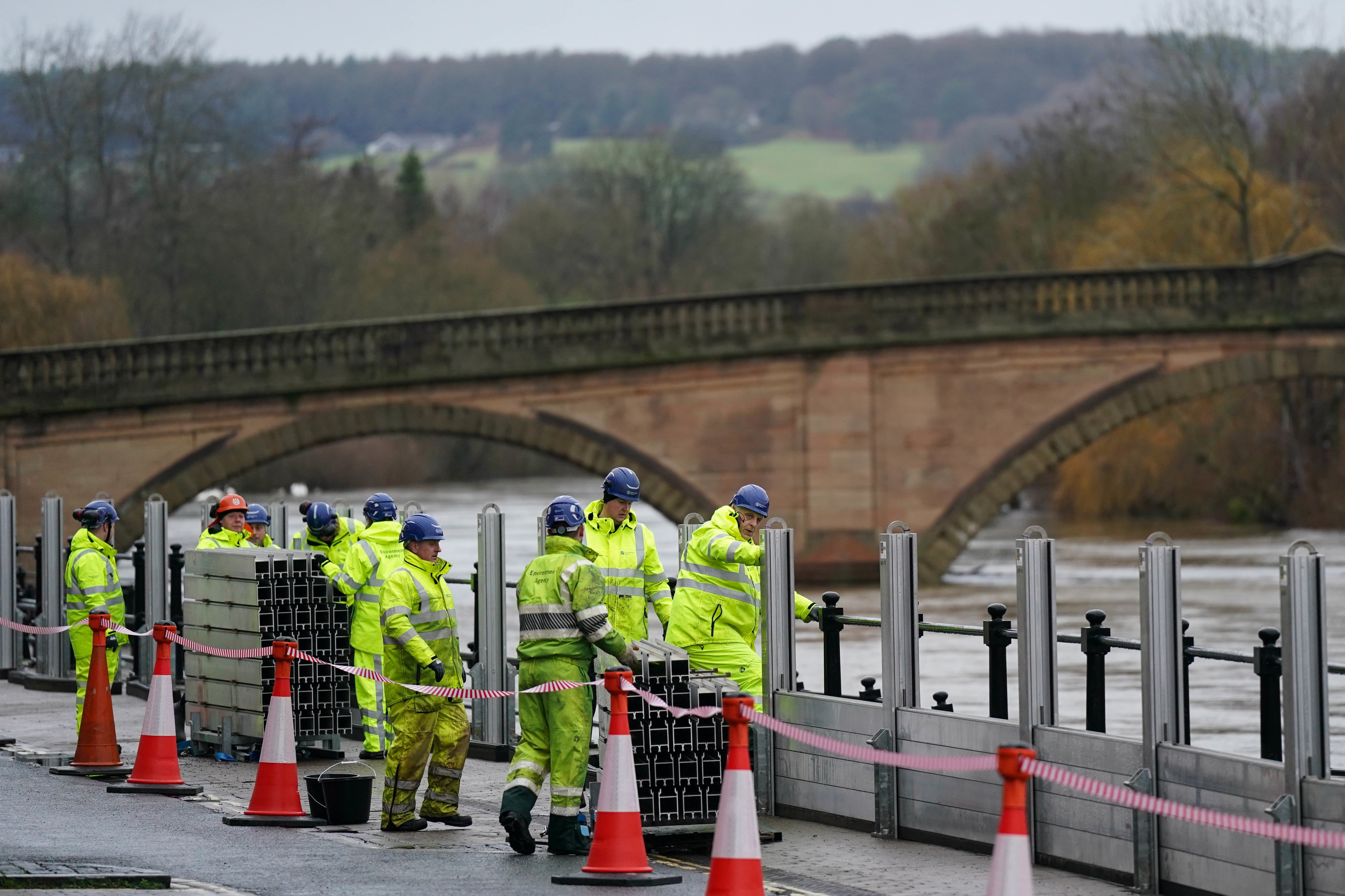 Workers from the Environment Agency install flood defences in Bewdley, Worcestershire