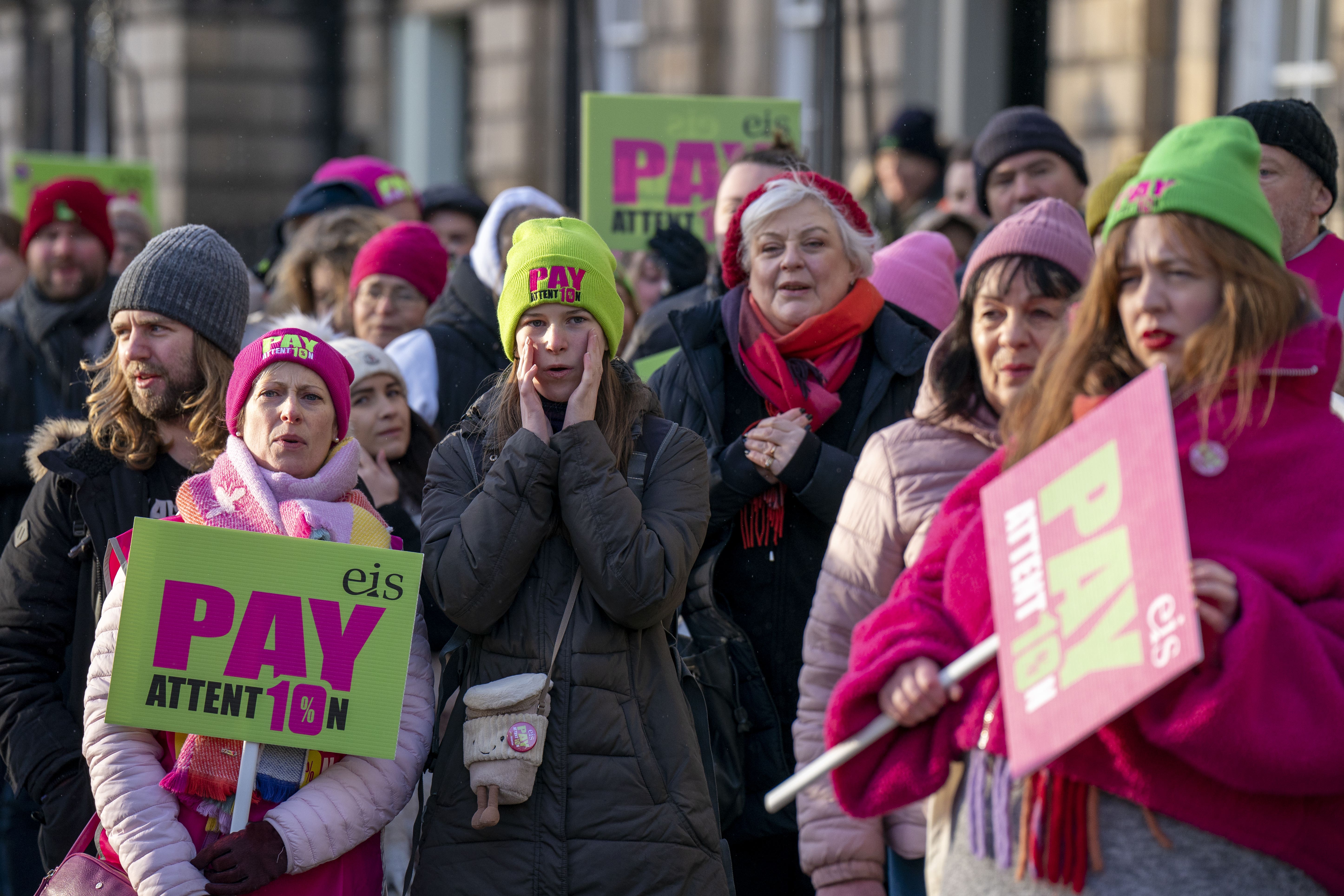 Members of the EIS union demonstrate outside Bute House in Edinburgh as part of their dispute over pay (Jane Barlow/PA)